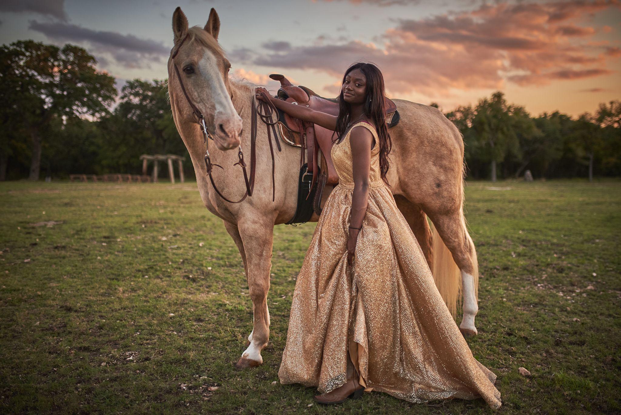 Woman in a gold gown standing beside a palomino horse at sunset — Pet Photography photography, Austin A woman in a gold gown standing beside a palomino horse at sunset.