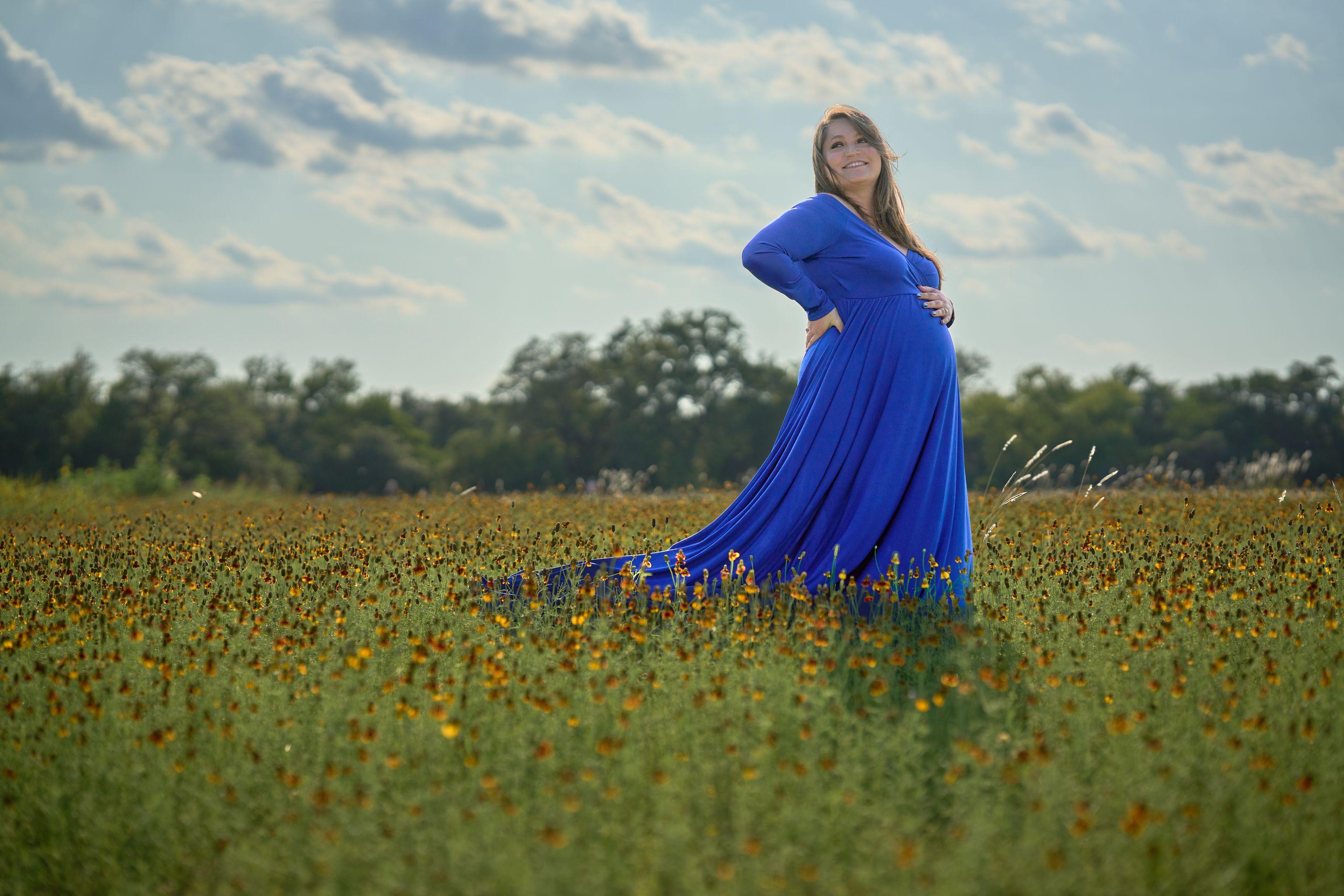 Expectant mother in a blue gown in a Texas wildflower field — Maternity photography, Austin Expectant mother in a blue gown in a Texas wildflower field