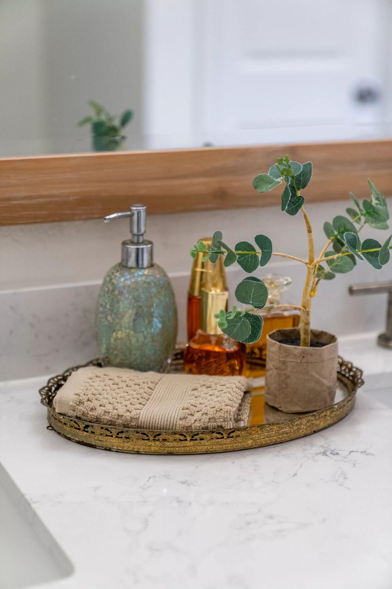 Close detail of a bathroom vanity tray with soap and eucalyptus — Architectural photography, Austin A close detail of a bathroom vanity tray with soap and eucalyptus.