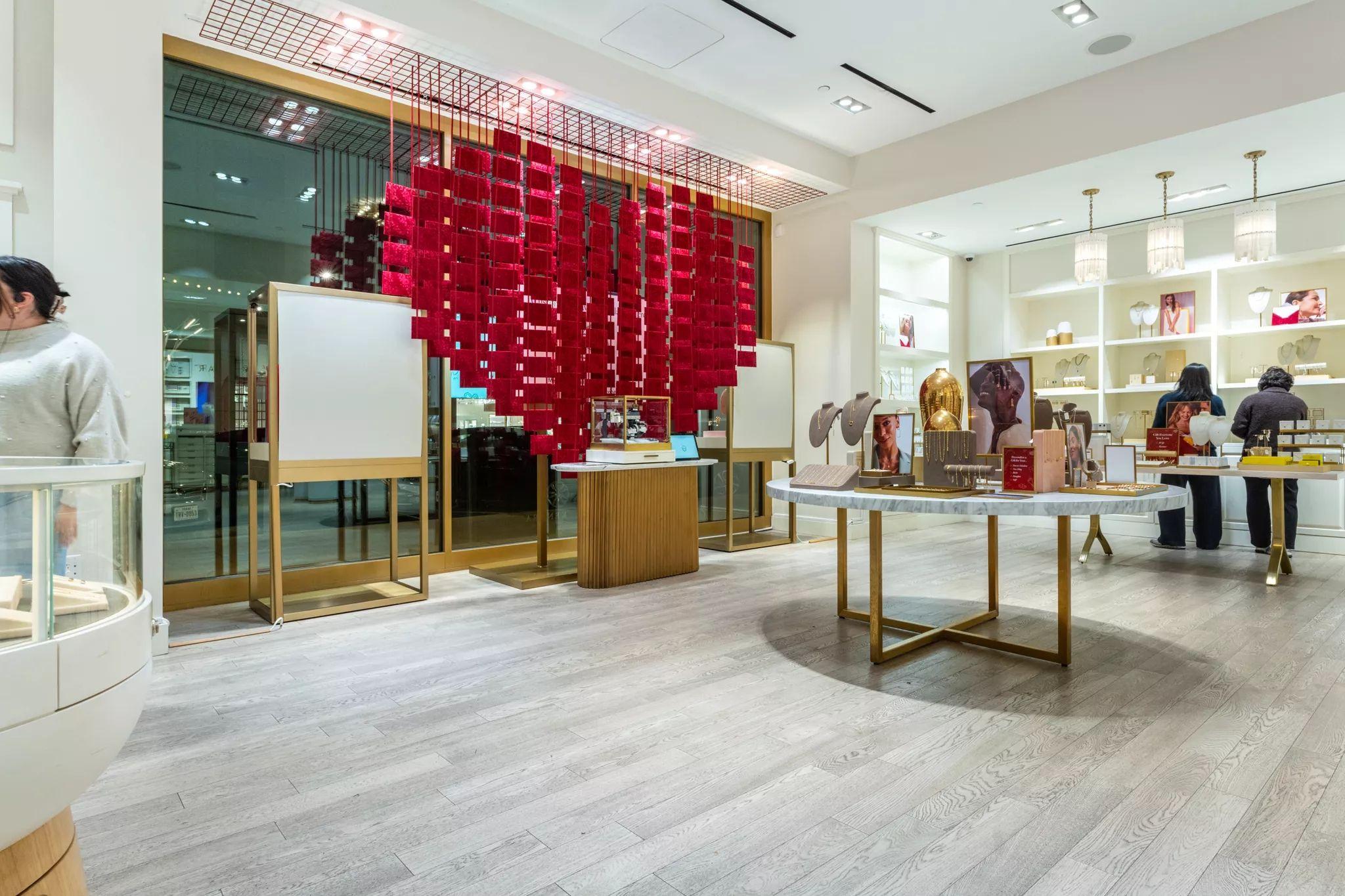 Giant heart built from hanging red envelopes suspended over a jewelry showroom floor — Brand Collaborations photography, Austin A giant heart built from hanging red envelopes suspended over a jewelry showroom floor.