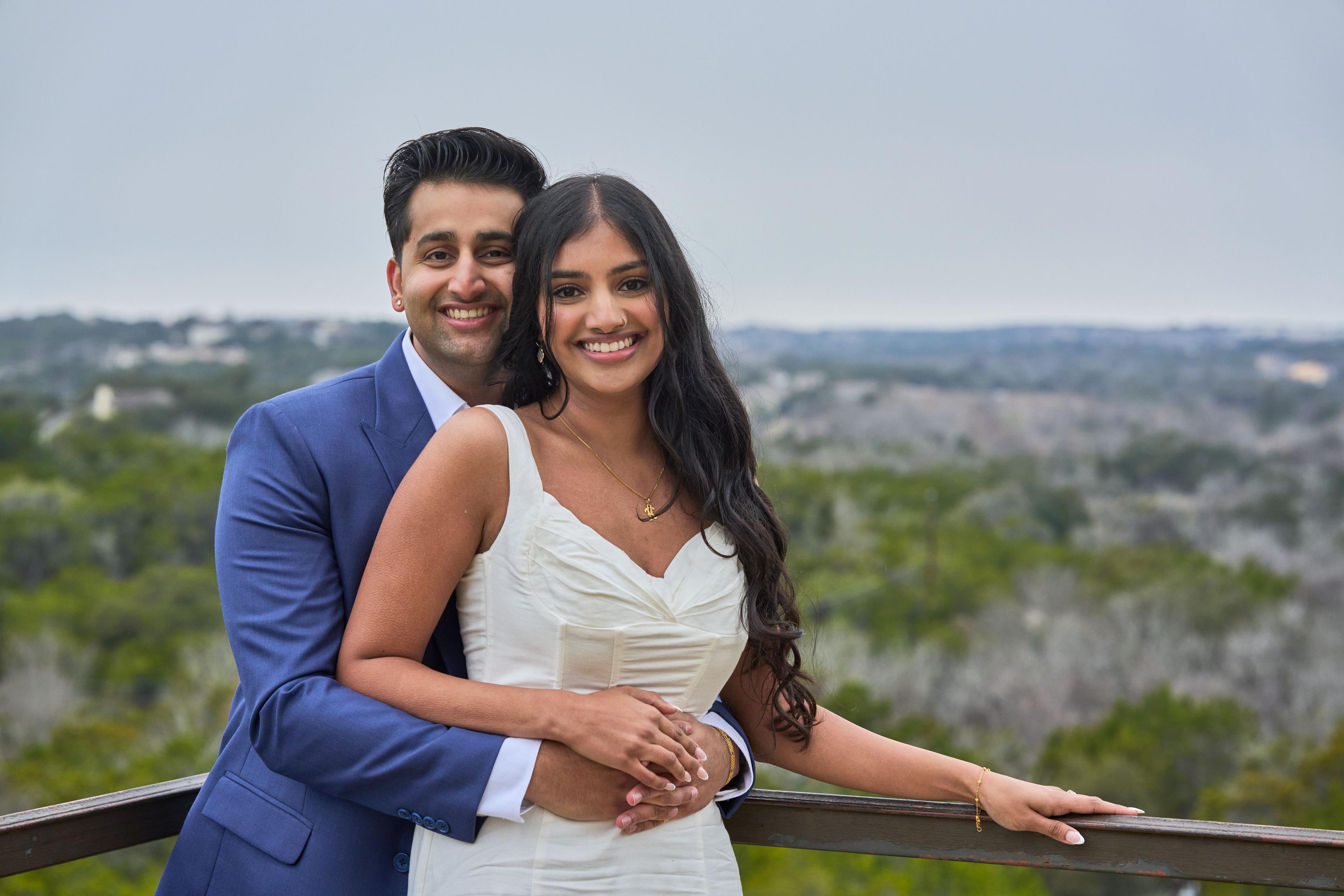 Couple at the Chapel Dulcinea overlook rail with the Hill Country running to the horizon — Chapel Dulcinea photography, Austin A couple at the Chapel Dulcinea overlook rail with the Hill Country running to the horizon behind them