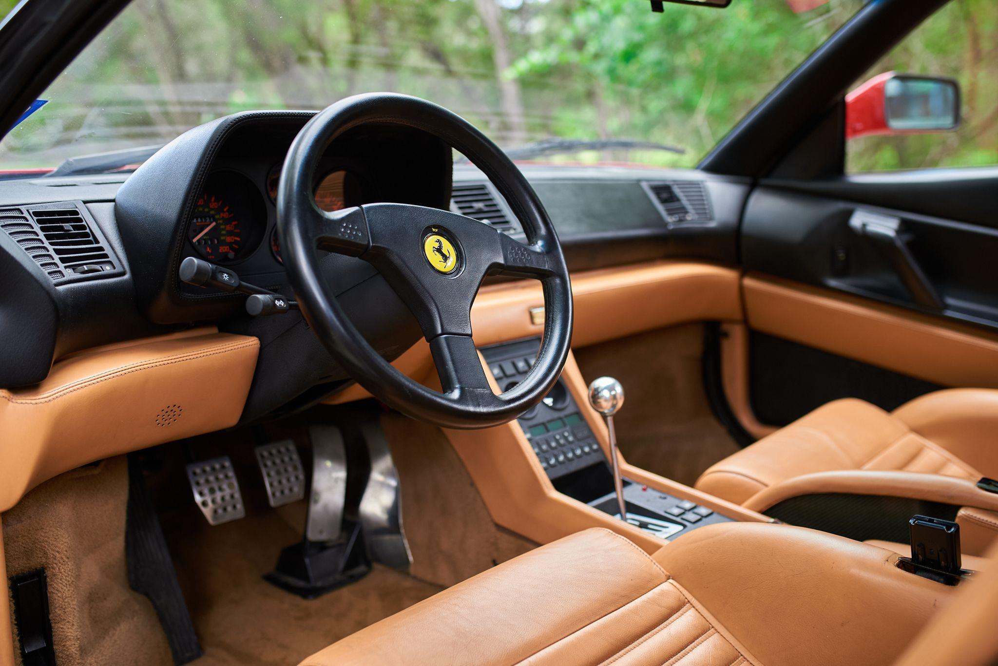 Tan leather interior and steering wheel of a classic Ferrari — Automotive photography, Austin The tan leather interior and steering wheel of a classic Ferrari.