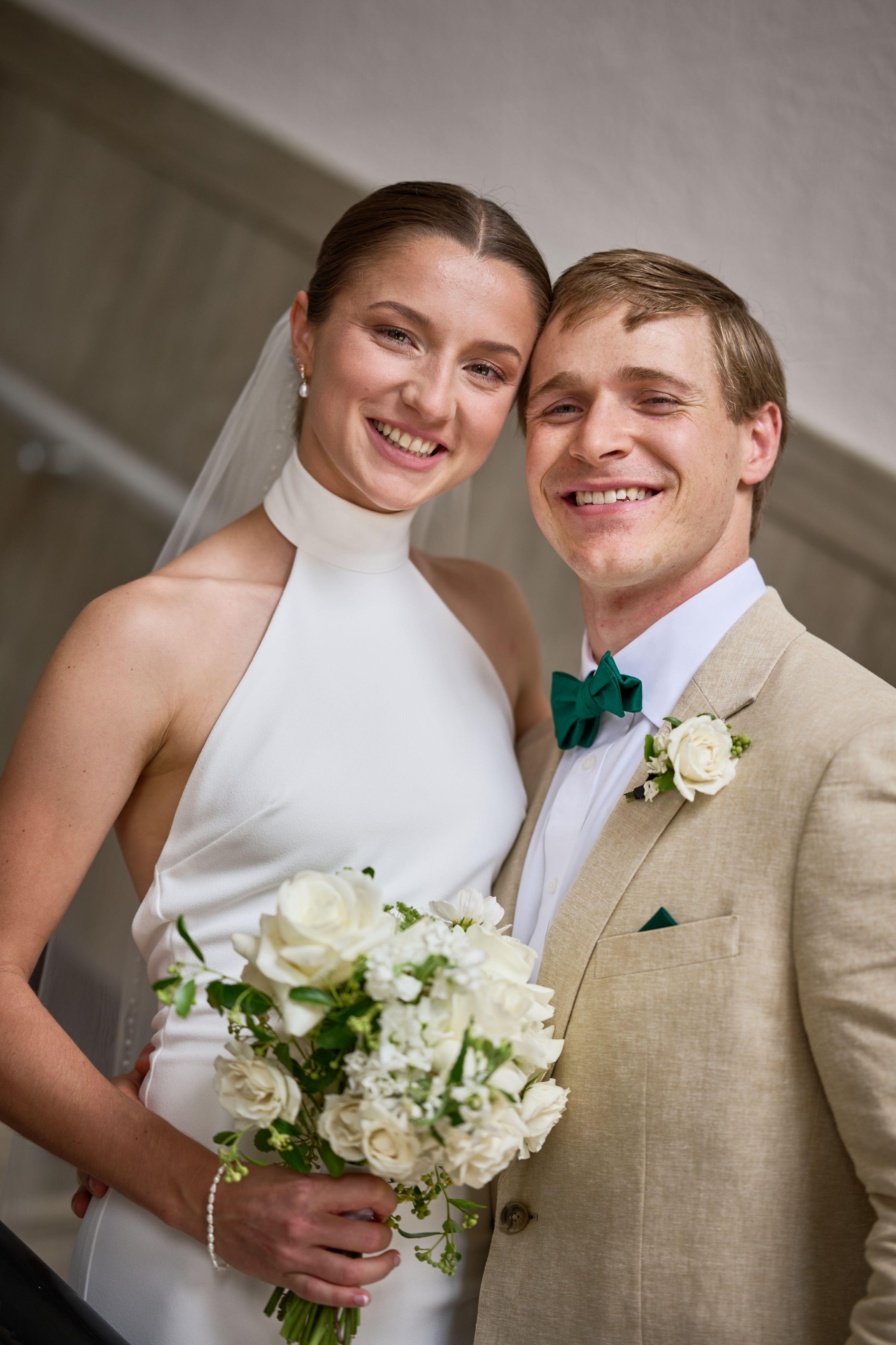 Bride and groom laughing together, his arm around her, bouquet held between them — Weddings photography, Austin A bride and groom laughing together, his arm around her, bouquet held between them.