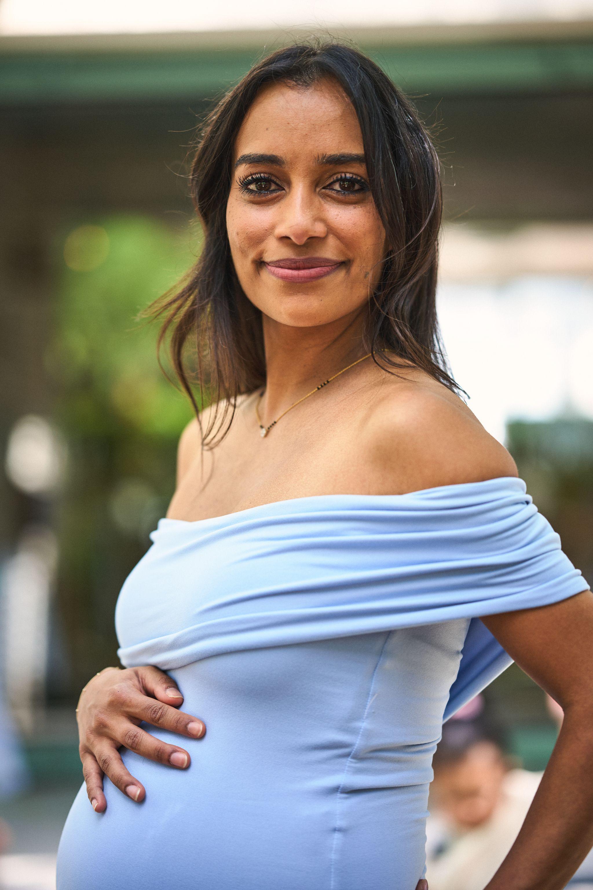 Expectant mother in a light blue off-shoulder dress — Maternity photography, Austin Expectant mother in a light blue off-shoulder dress