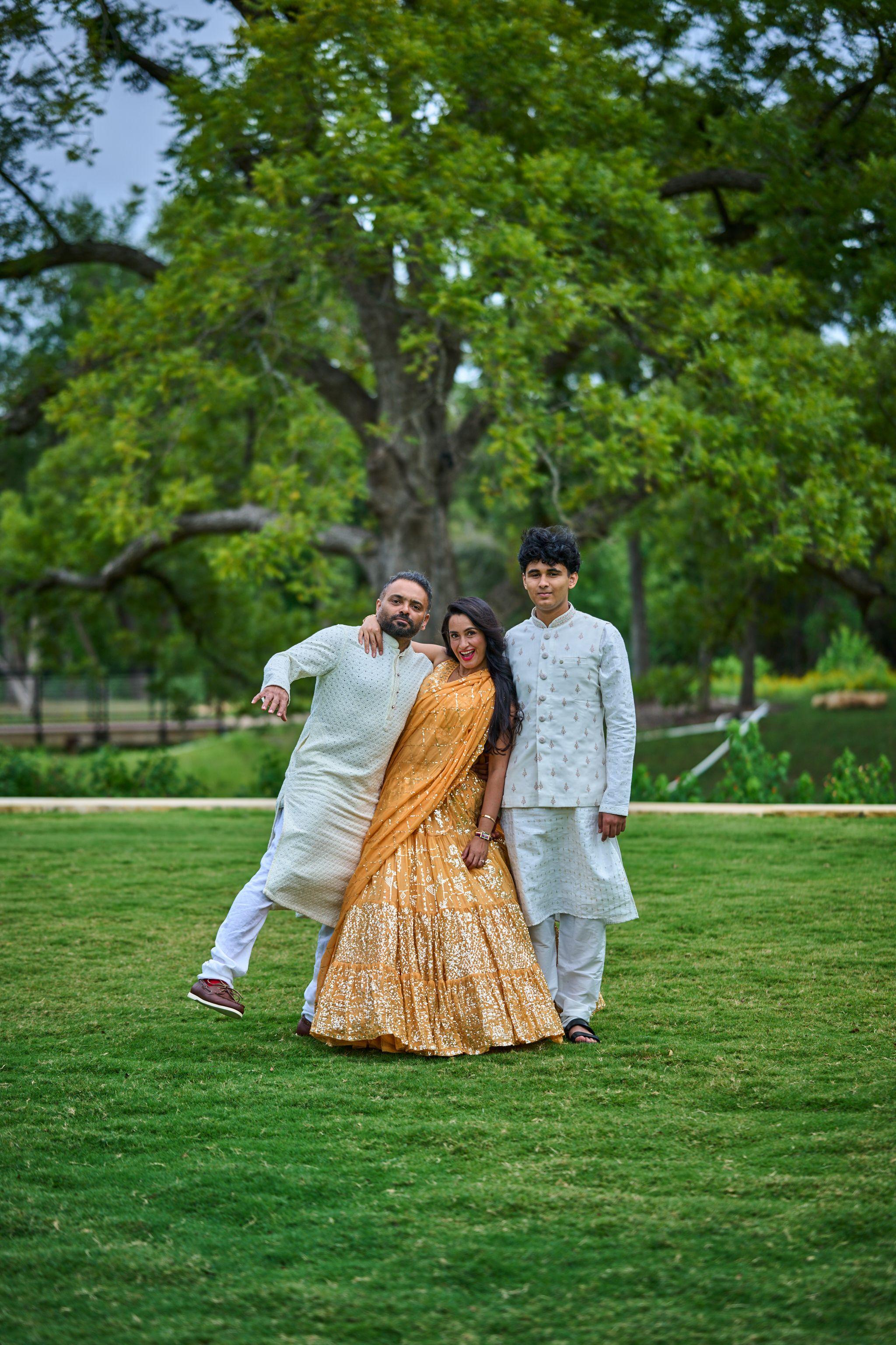 Family walking together and laughing across the lawn at the Cedar Park Public Library — Cedar Park Public Library photography, Austin A family walking together and laughing across the lawn at the Cedar Park Public Library