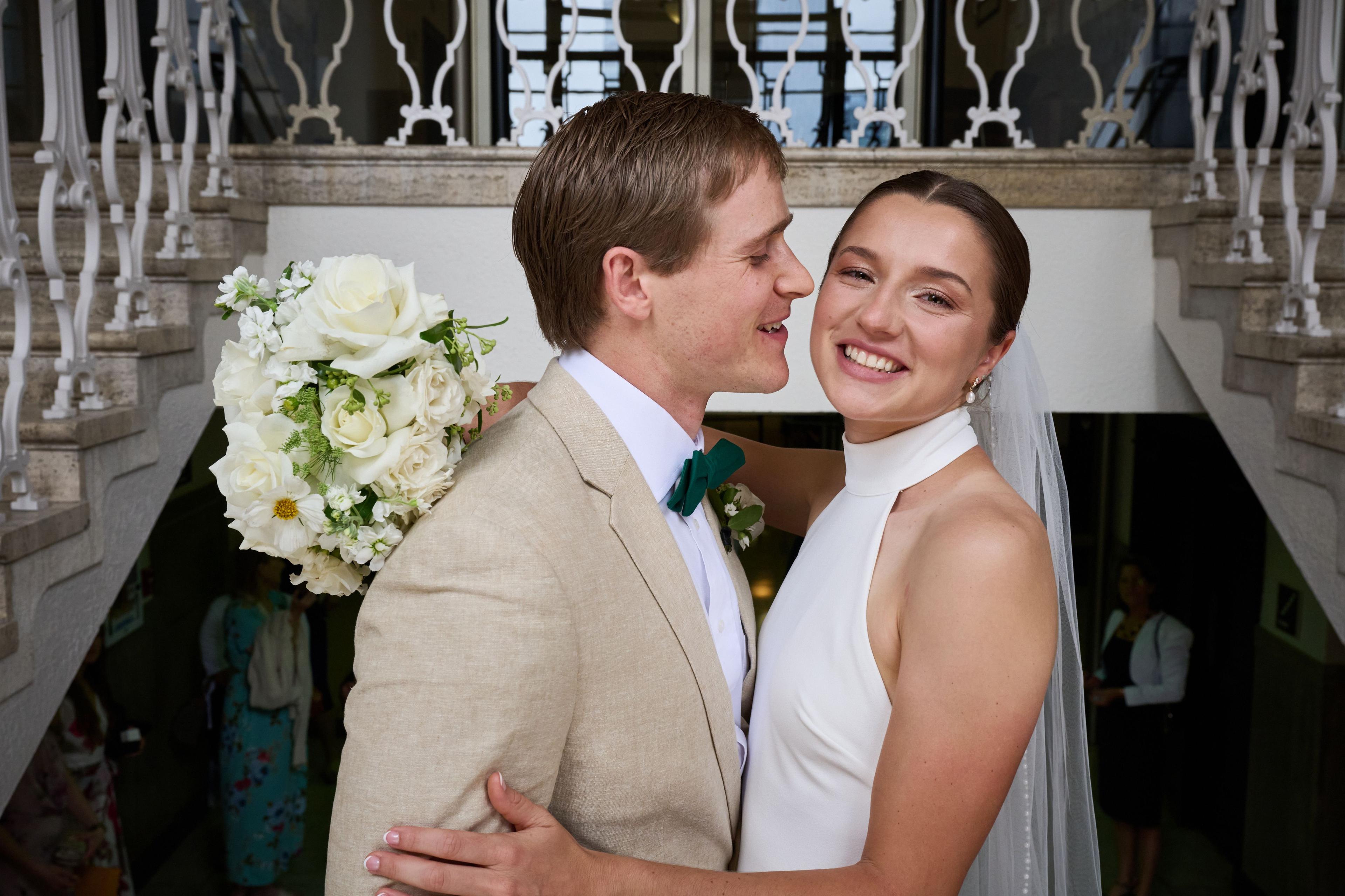 Bride and groom looking at each other on a balcony above the courthouse atrium — Weddings photography, Austin A bride and groom looking at each other on a balcony above the courthouse atrium.