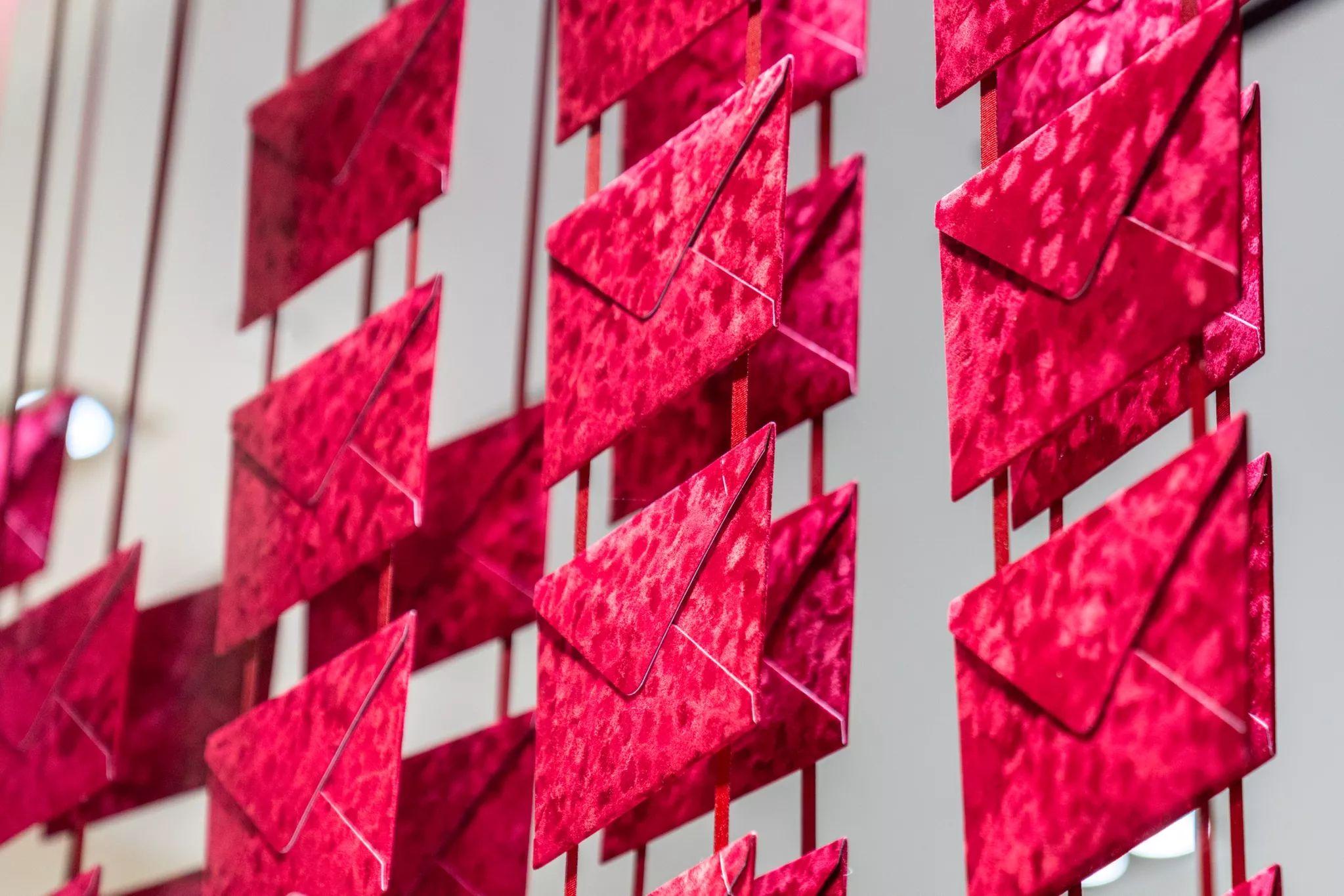 Close detail of a pink geometric branded wall installation — Brand activation photography, Austin A close detail of a pink geometric branded wall installation.