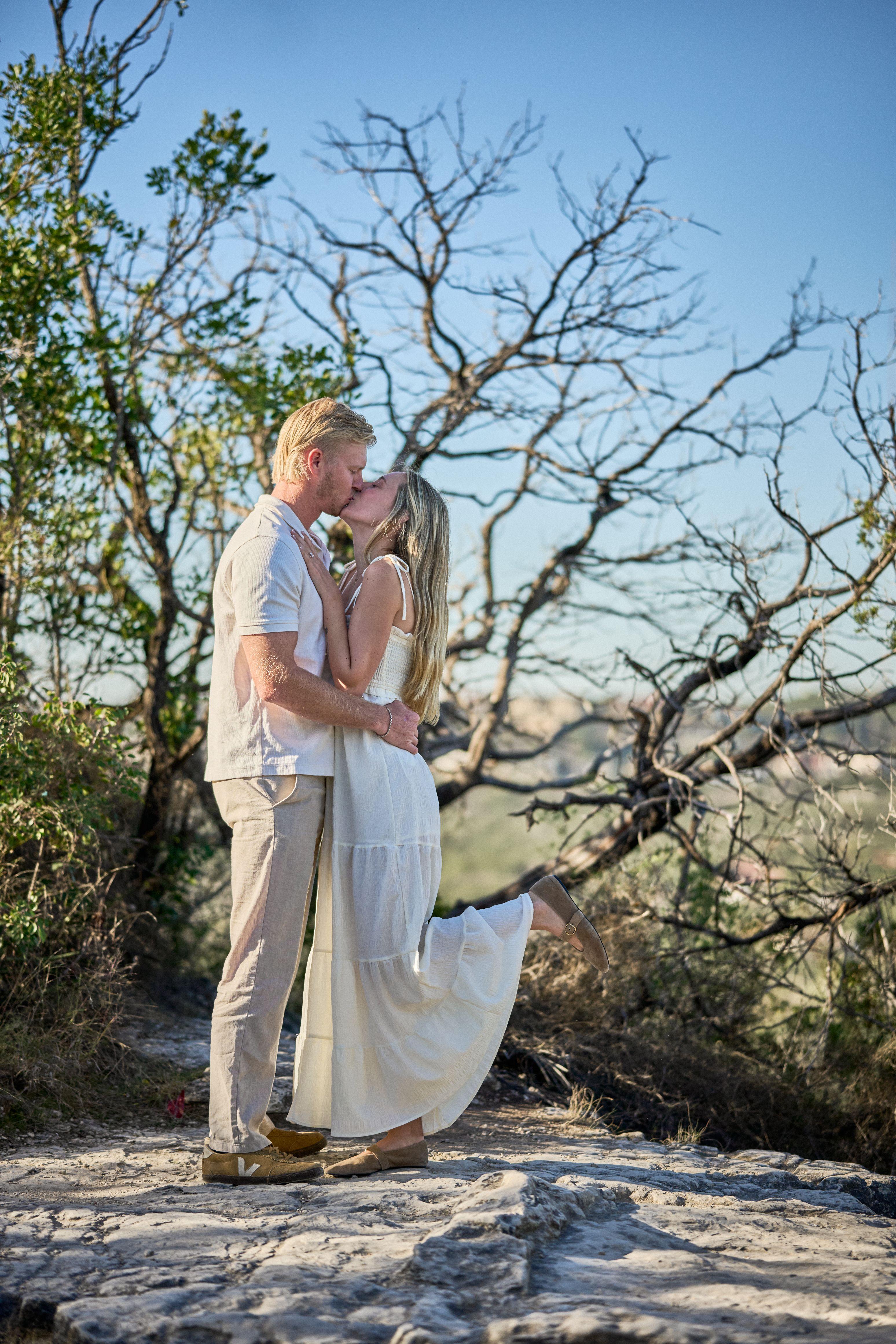 Couple embracing beneath a tree at Mount Bonnell at golden hour — Engagement & Proposals photography, Austin Couple embracing beneath a tree at Mount Bonnell at golden hour