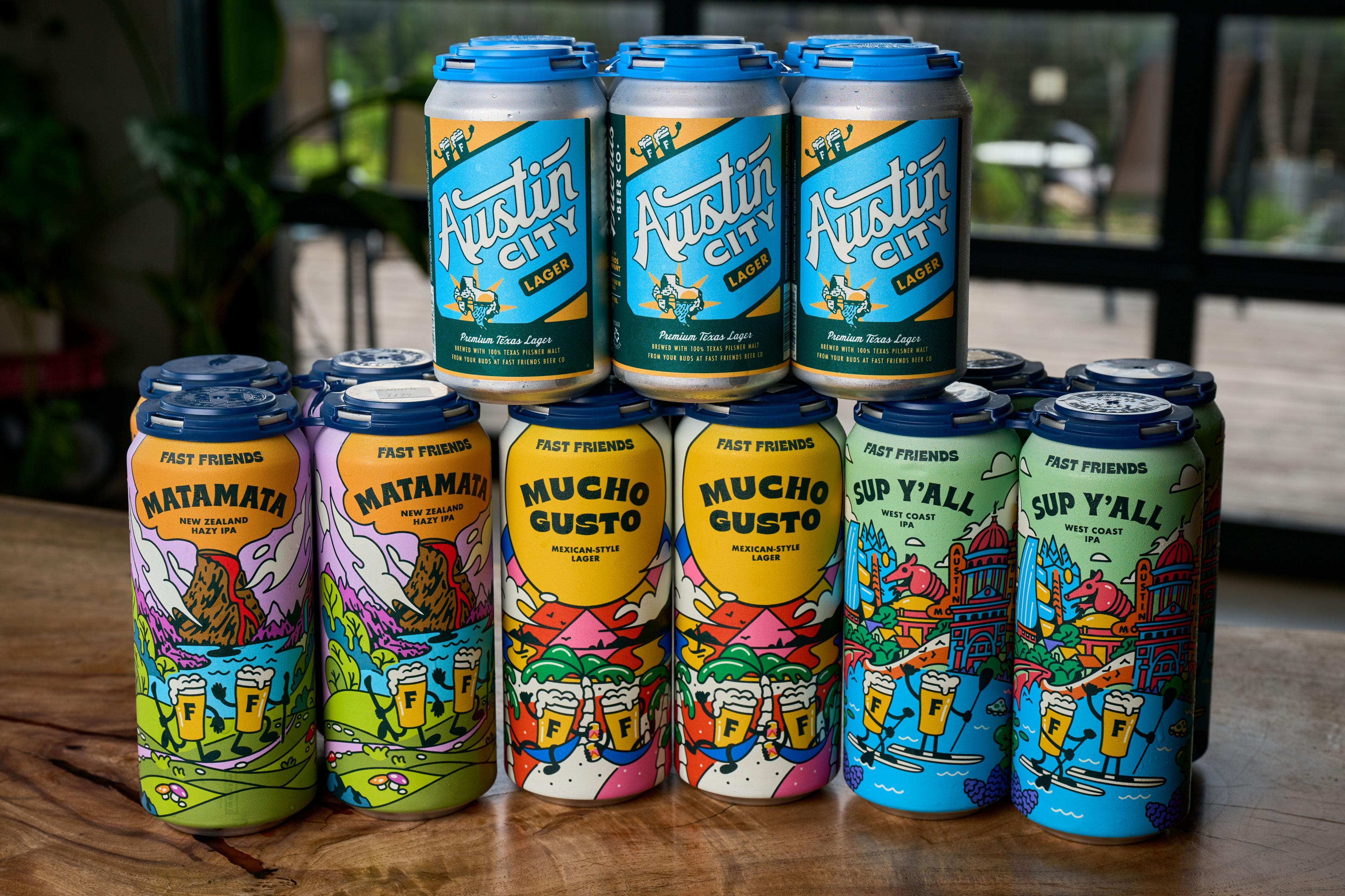Stacked four-packs of colorful craft beer cans on a wooden table — Brand Collaborations photography, Austin Stacked four-packs of colorful craft beer cans on a wooden table.