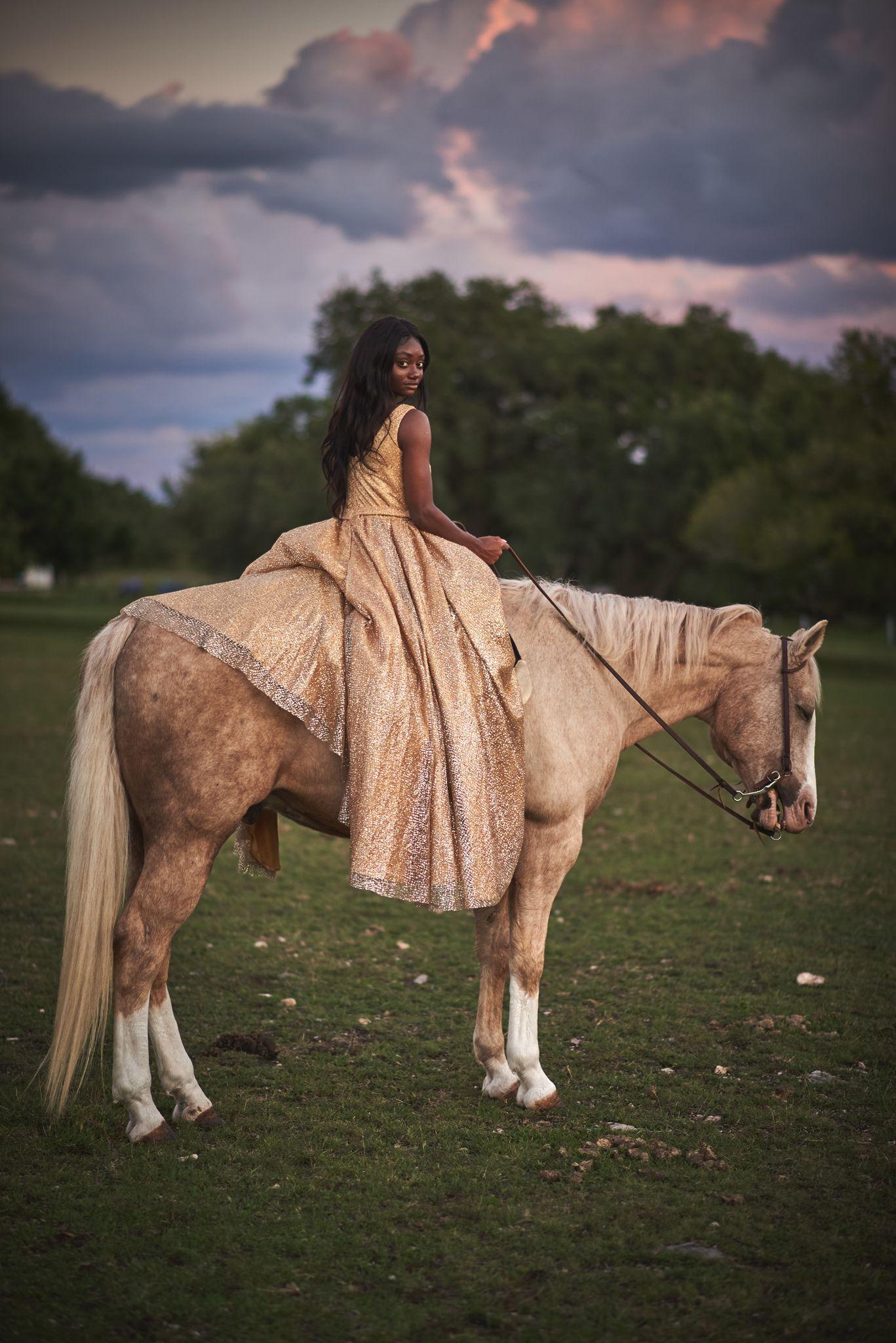Woman in a gold gown riding a palomino horse in a field at dusk — Adventure & outdoor photography, Austin A woman in a gold gown riding a palomino horse in a field at dusk.