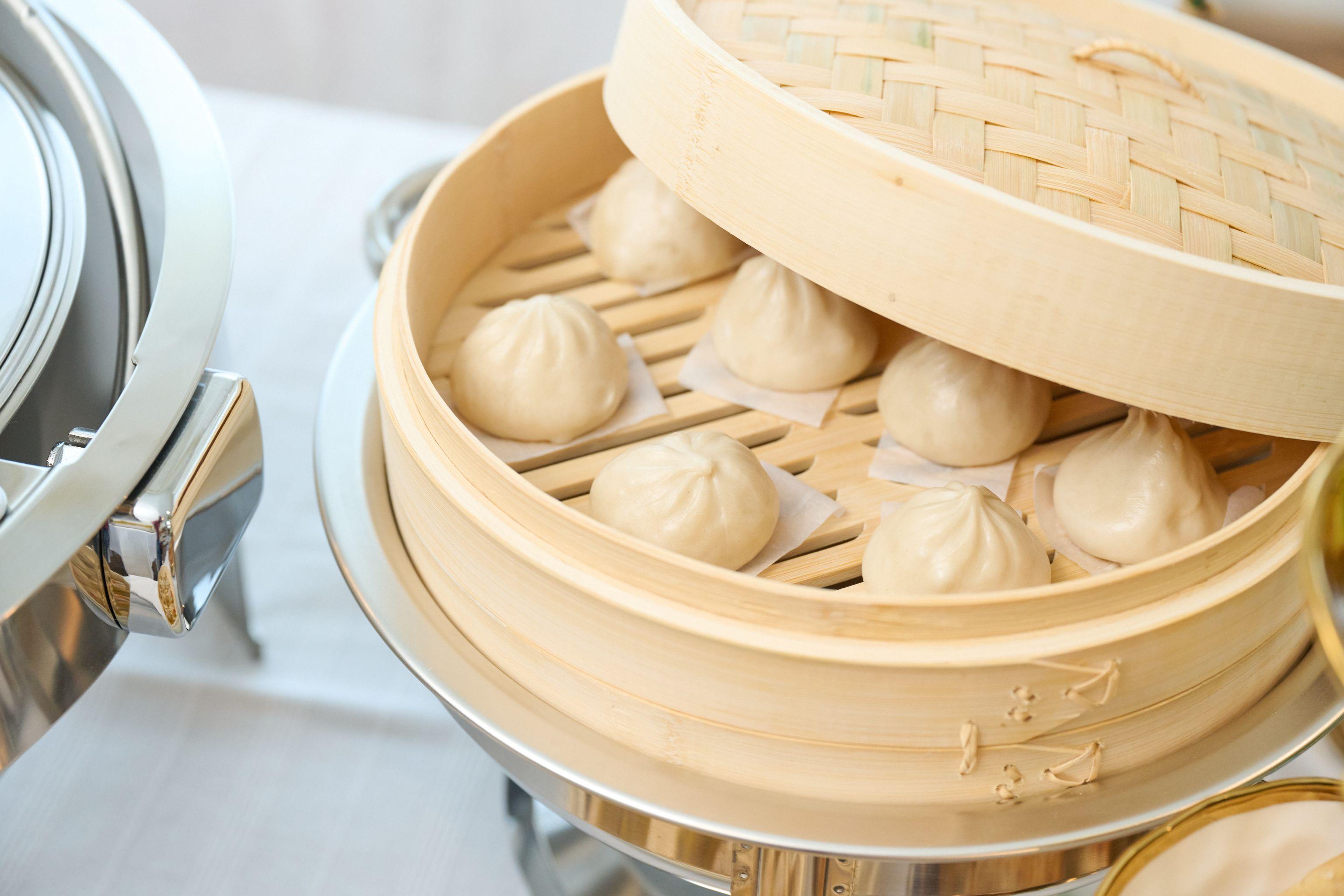 Steamed bao buns in a stacked bamboo steamer — Food & restaurant photography, Austin Steamed bao buns in a stacked bamboo steamer.