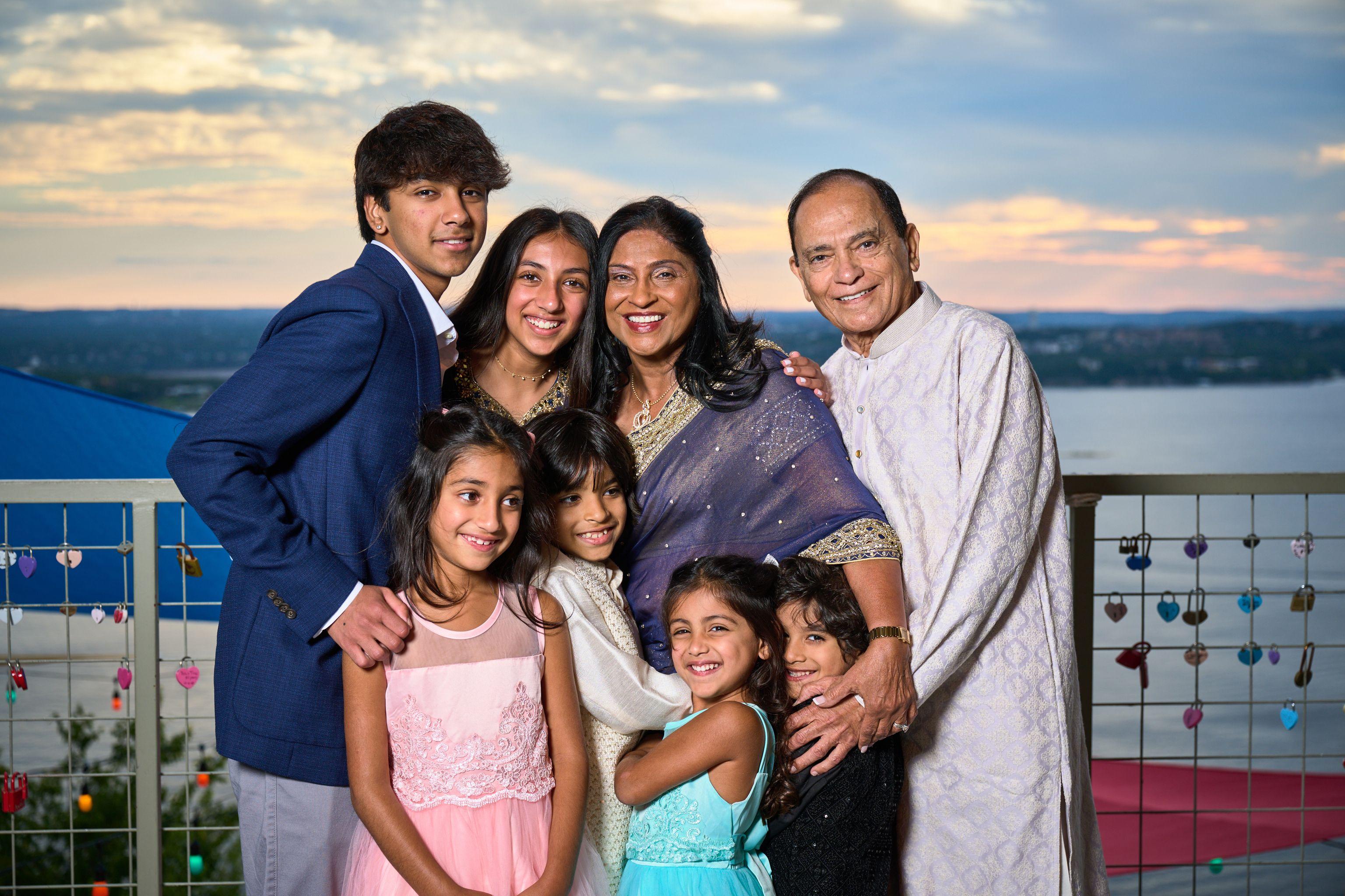 Extended family gathered on the top deck at The Oasis with Lake Travis and the sunset — The Oasis on Lake Travis photography, Austin An extended family gathered on the top deck at The Oasis with Lake Travis and the sunset behind them