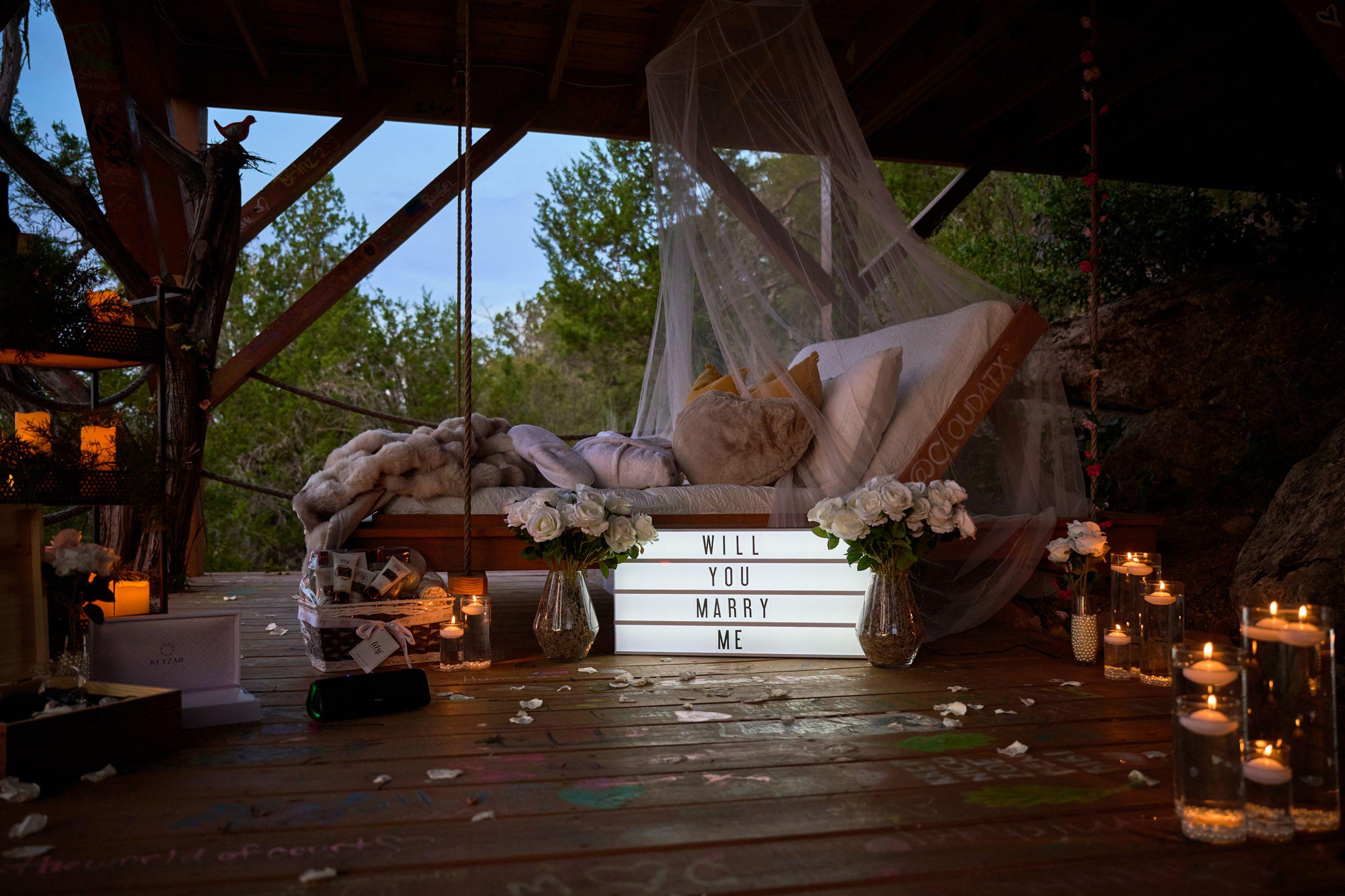 Dockside proposal setup with cushions, flowers and a WILL YOU MARRY ME light box — Engagement & Proposals photography, Austin A dockside proposal setup with cushions, flowers and a WILL YOU MARRY ME light box.