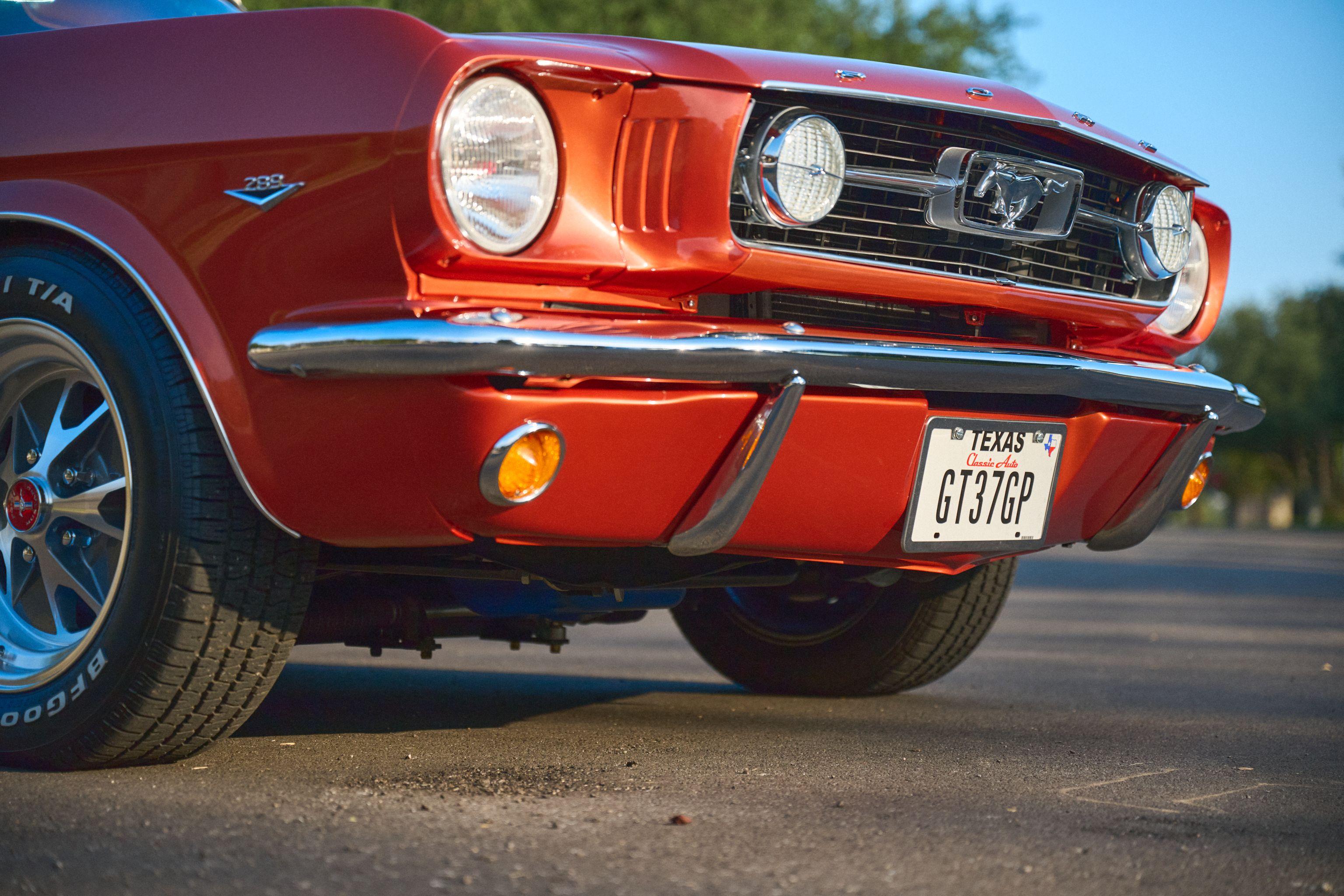 Front grille, headlights and bumper of an orange classic Mustang — Automotive photography, Austin The front grille, headlights and bumper of an orange classic Mustang.