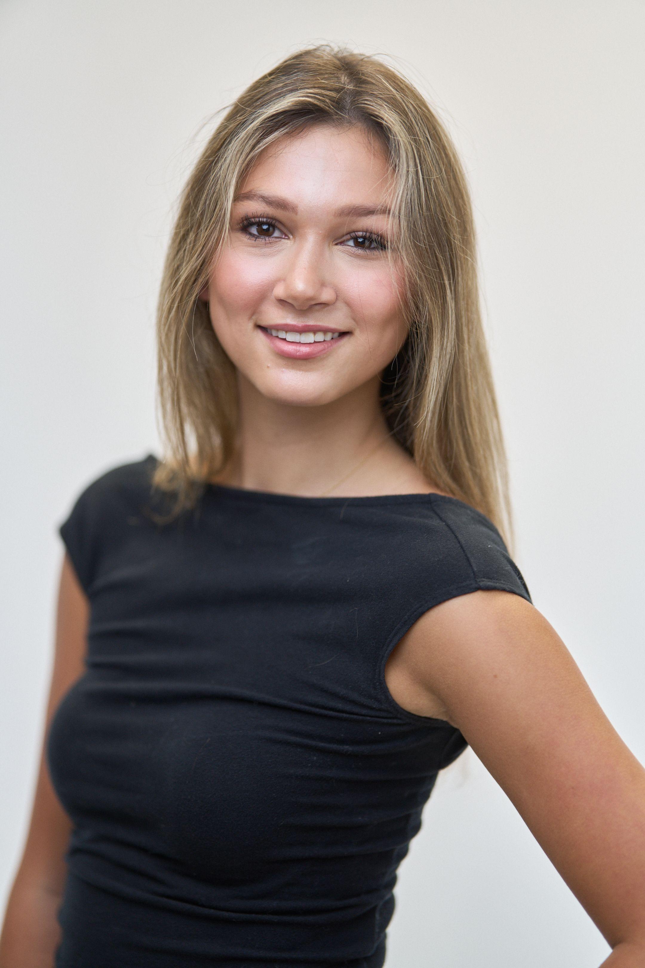 Three-quarter studio digital of a model in a black cap-sleeve top — Fashion & editorial photography, Austin A three-quarter studio digital of a model in a black cap-sleeve top.