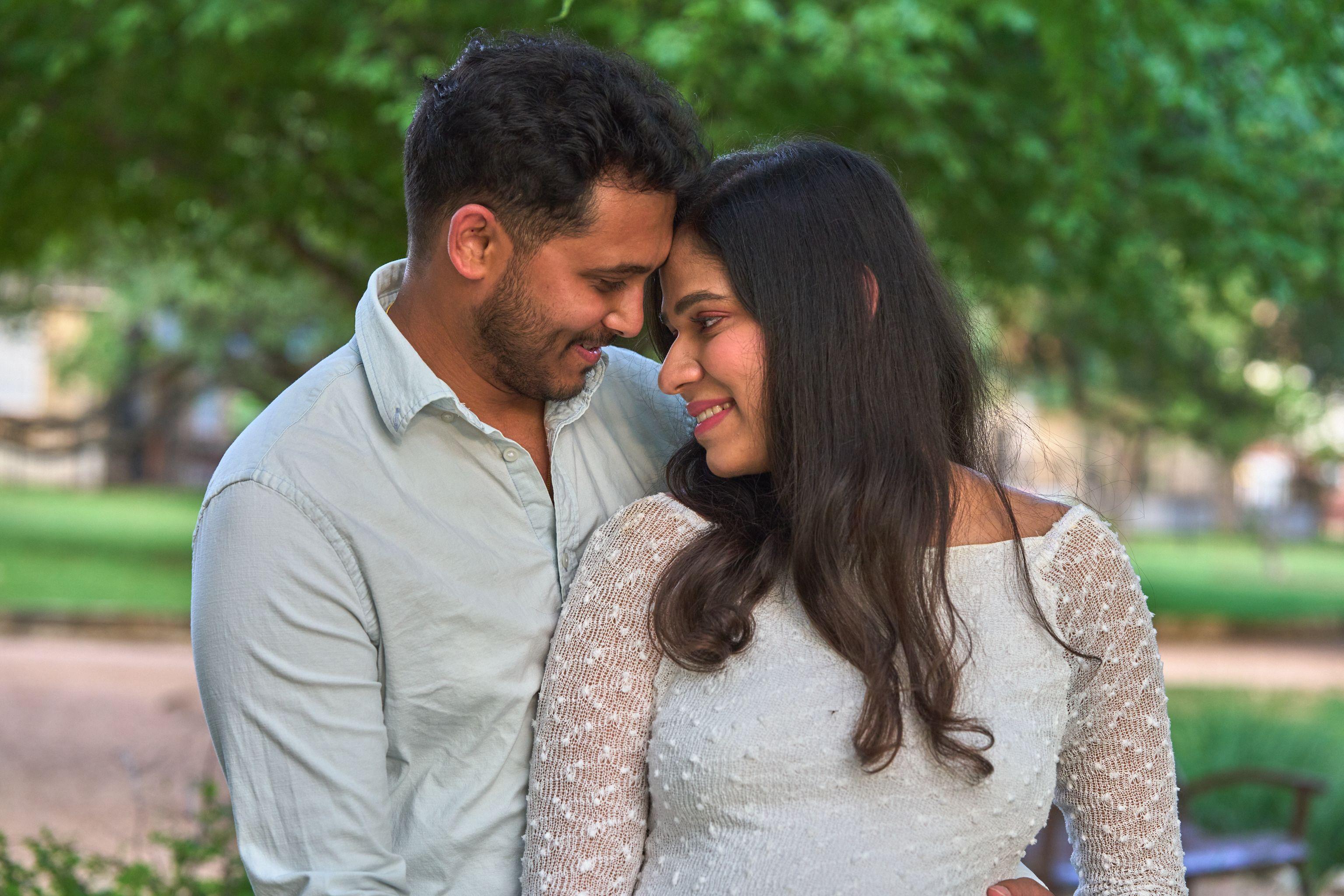 Expectant couple embracing in warm evening light — Maternity photography, Austin Expectant couple embracing in warm evening light
