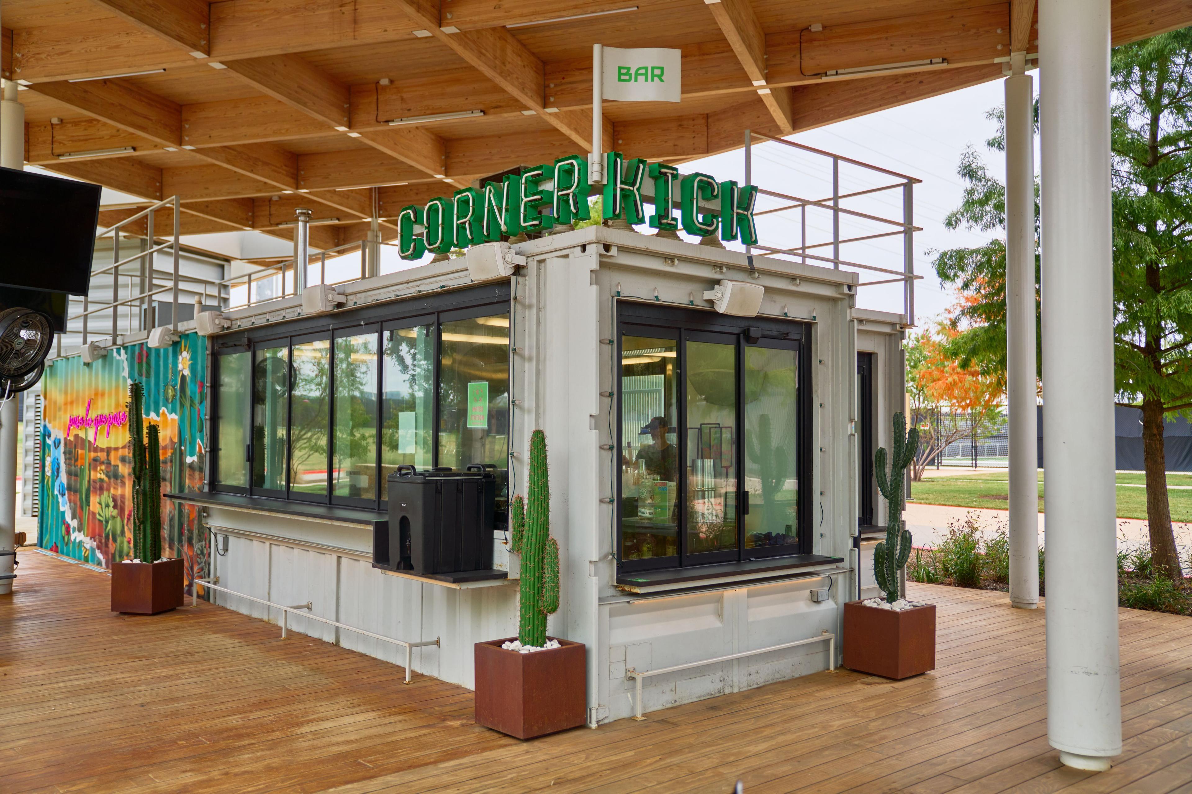 Corner Pick shipping-container bar under a covered patio — Food & restaurant photography, Austin The Corner Pick shipping-container bar under a covered patio.