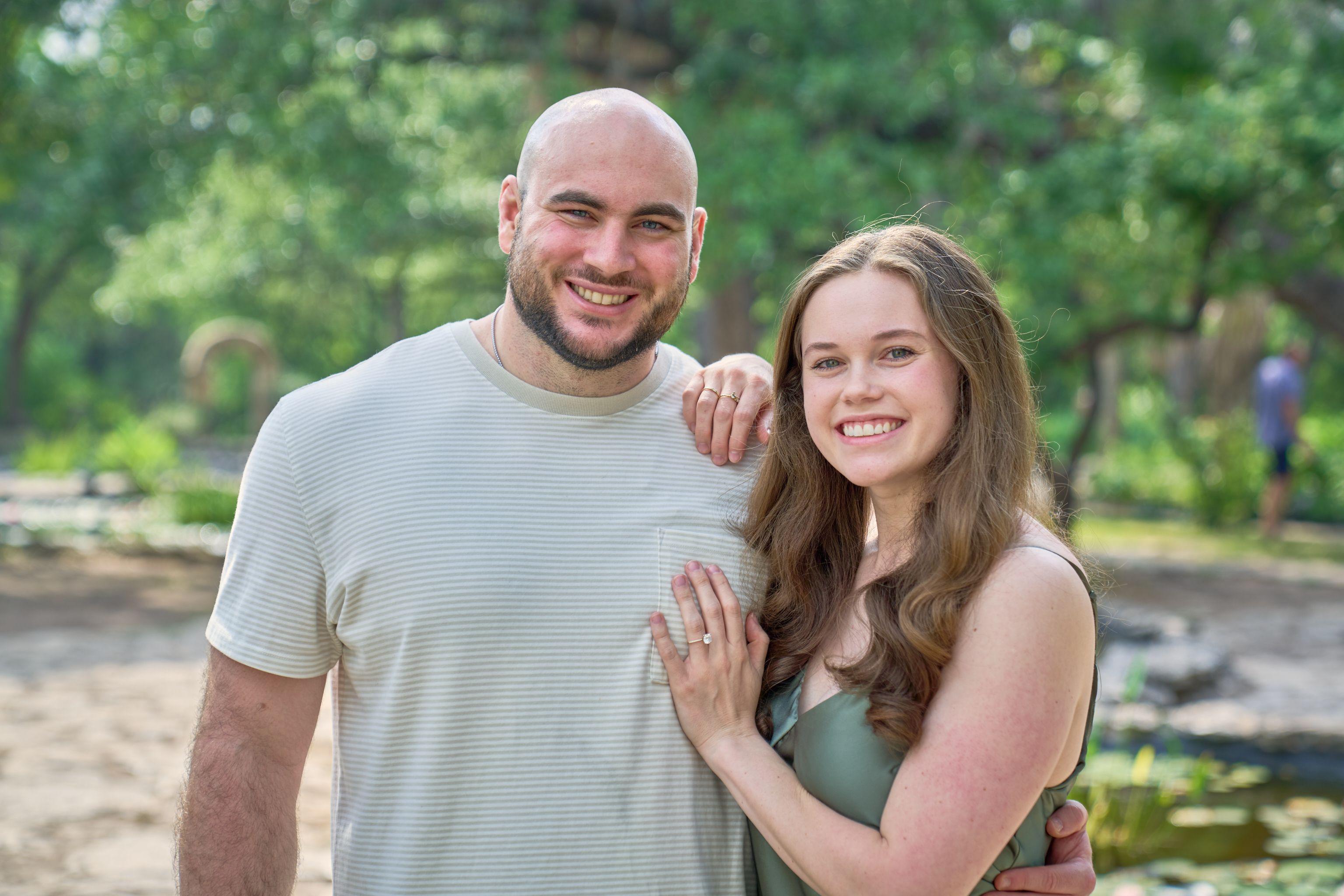 Couple standing cheek to cheek at Mayfield Park, her engagement ring on his shoulder — Mayfield Park photography, Austin A couple standing cheek to cheek at Mayfield Park, her engagement ring on his shoulder