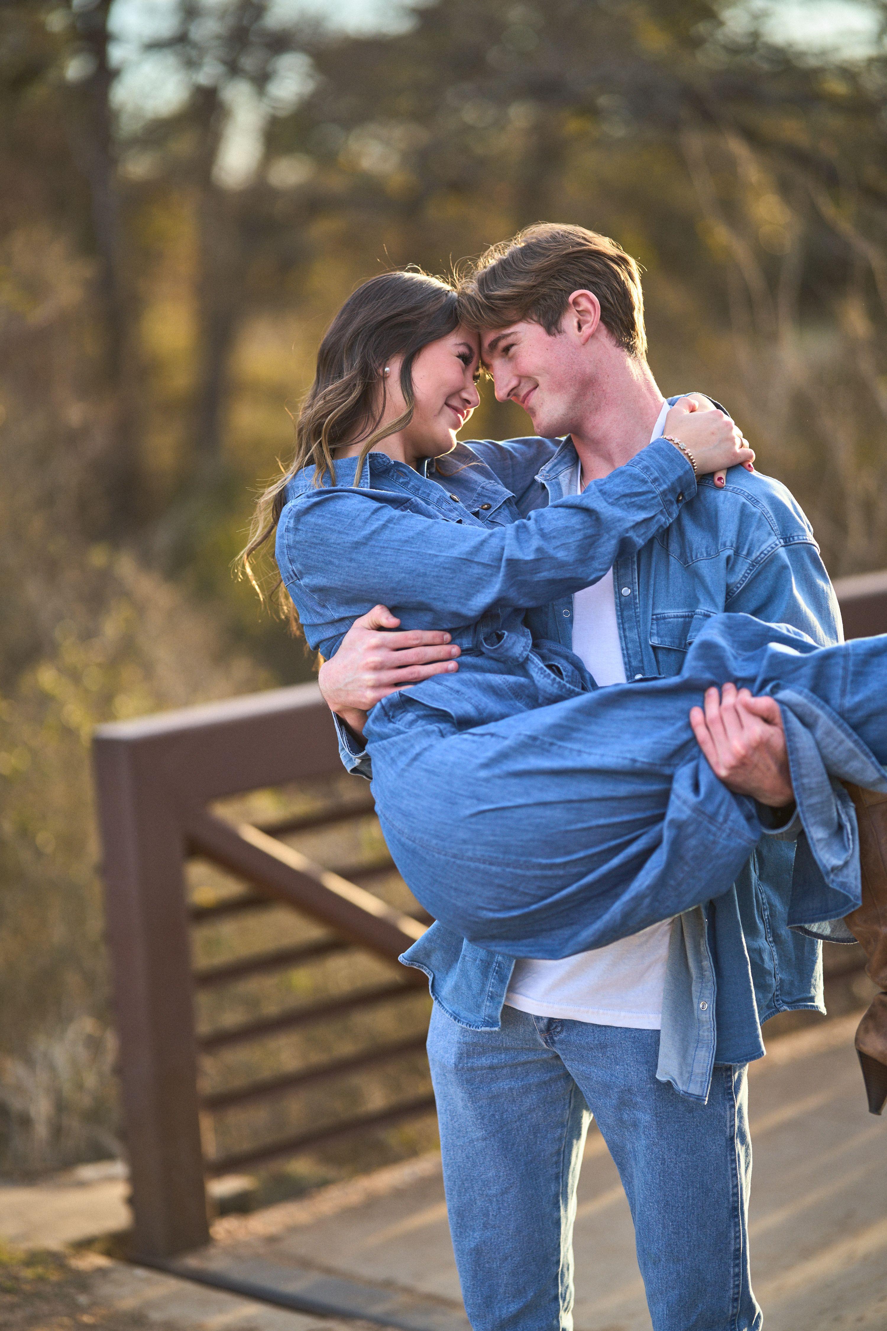 Couple in denim on the bridge at Brushy Creek Lake Park, foreheads together and laughing — Brushy Creek Lake Park photography, Austin A couple in denim on the bridge at Brushy Creek Lake Park, foreheads together and laughing