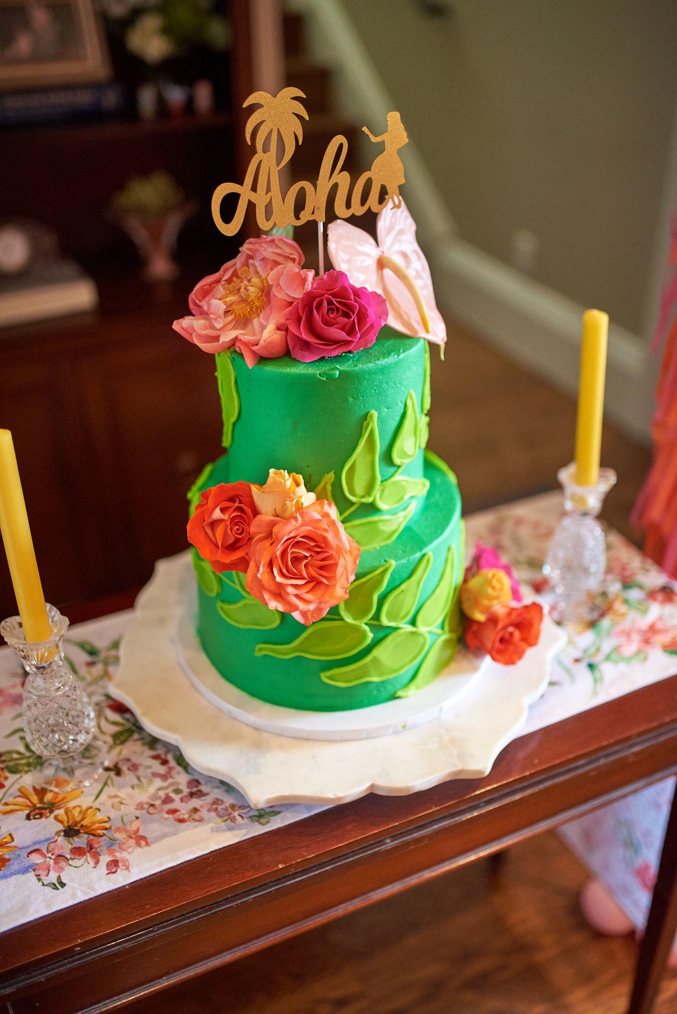 Green two-tier celebration cake topped with an 'Aloha' script topper and fresh roses — Formal Celebrations photography, Austin A green two-tier celebration cake topped with an 'Aloha' script topper and fresh roses.