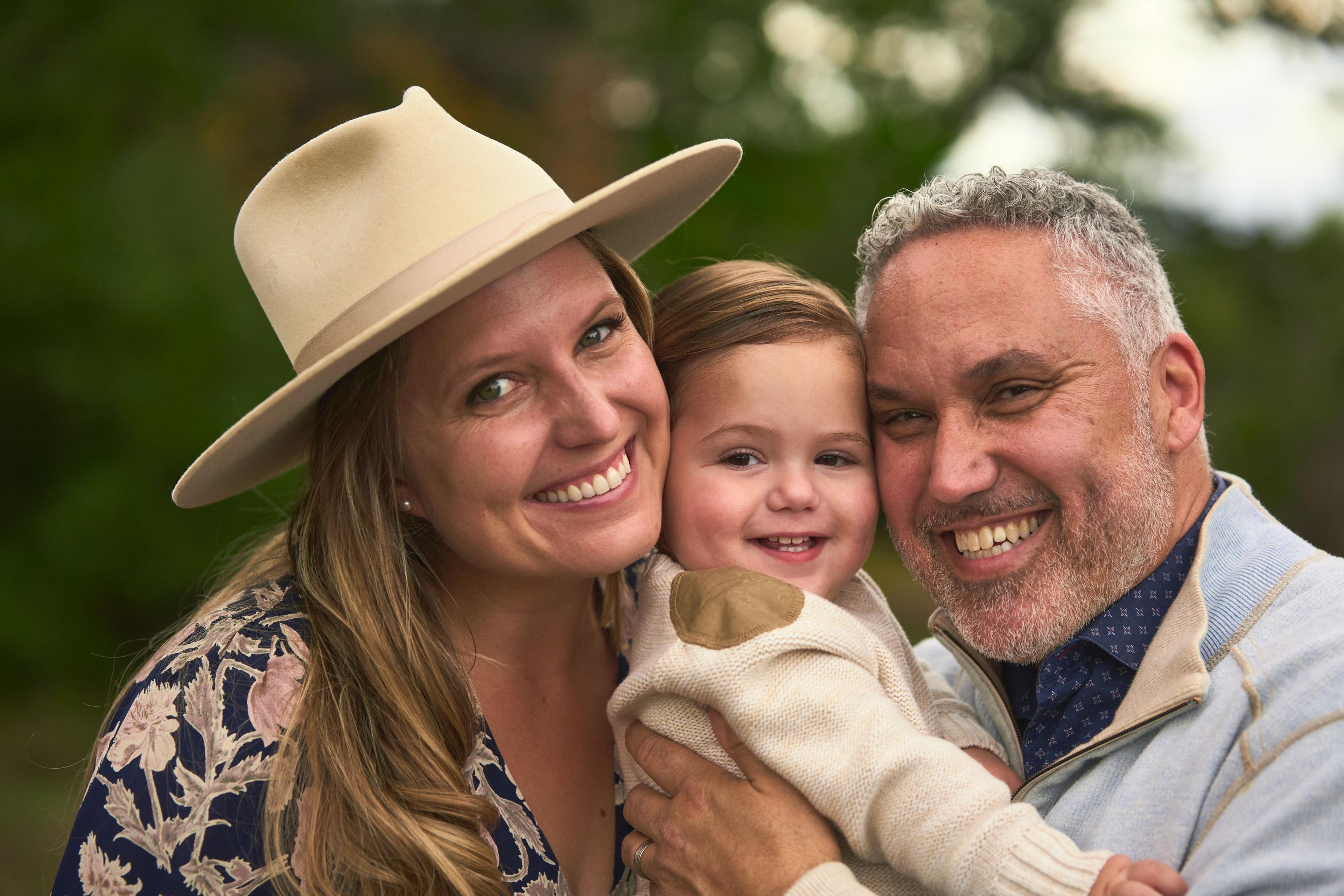 Family of four standing together in the tall grass on the Circle C greenbelt — Circle C Ranch photography, Austin A family of four standing together in the tall grass on the Circle C greenbelt
