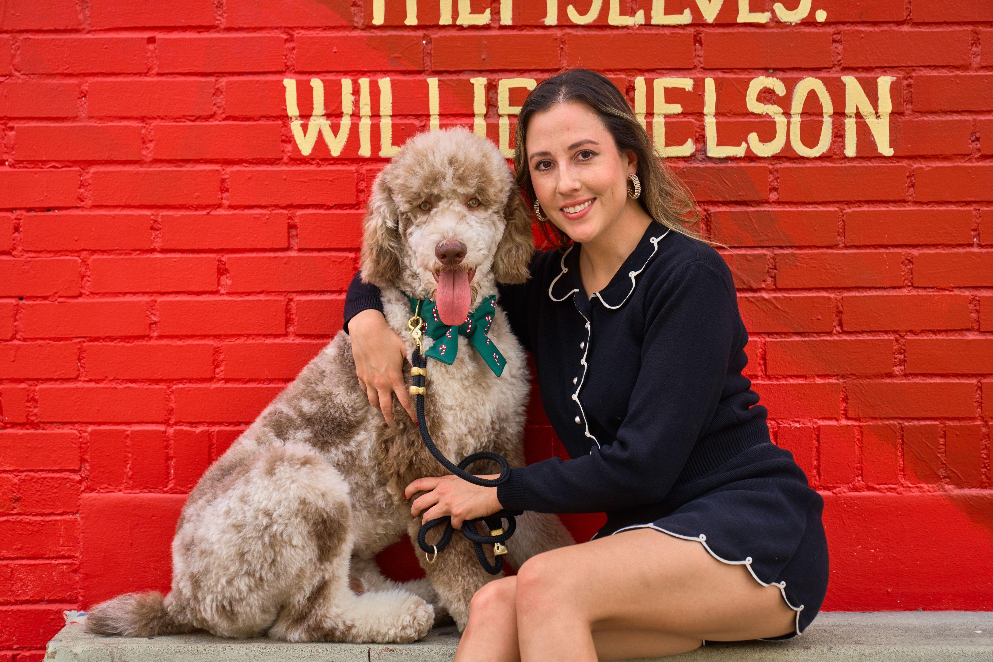 Woman and a large poodle in front of the Willie Nelson mural — Portrait photography, Austin A woman and a large poodle in front of the Willie Nelson mural.