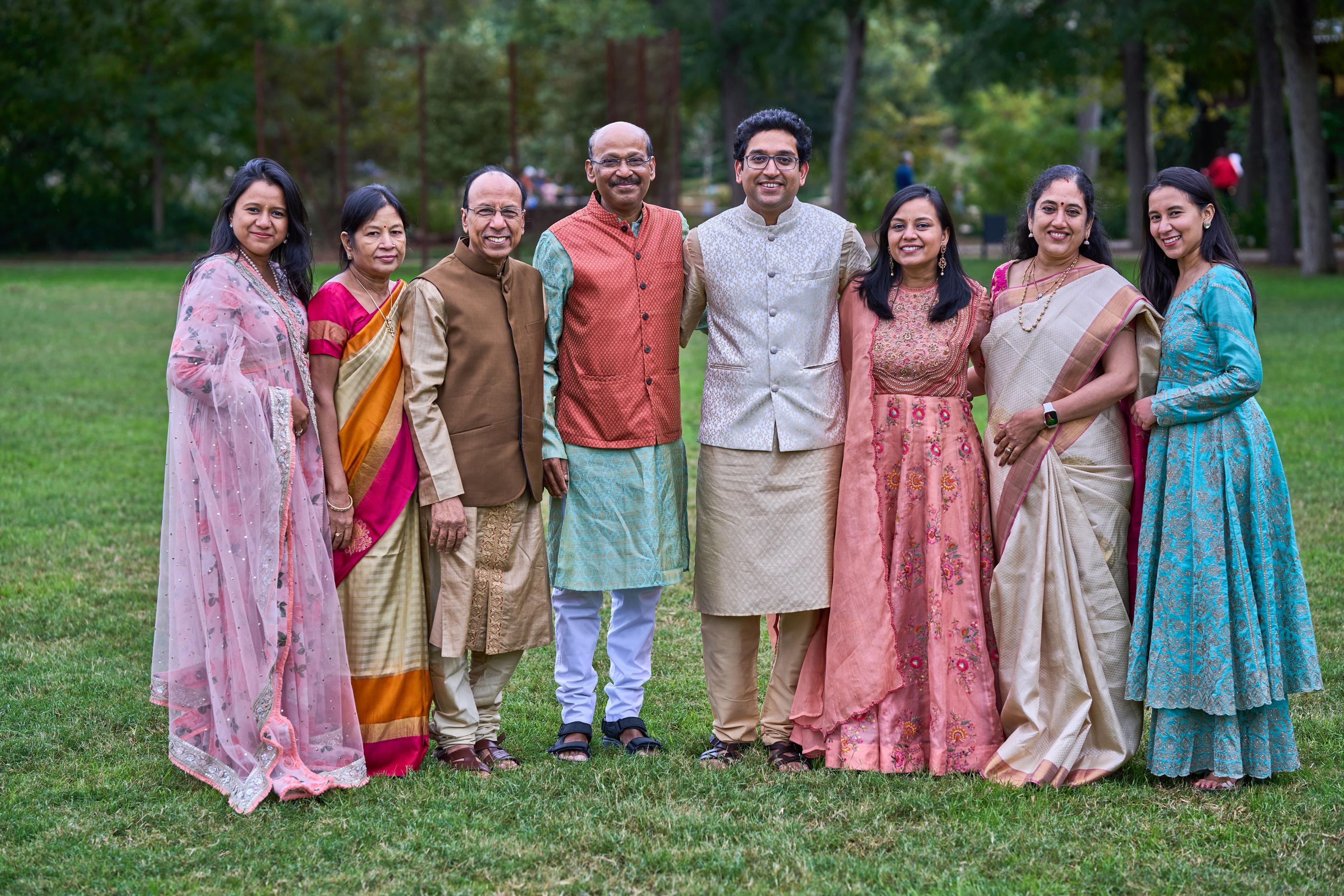 Extended family in traditional Indian dress standing together on the lawn at Pease Park — Pease Park photography, Austin An extended family in traditional Indian dress standing together on the lawn at Pease Park