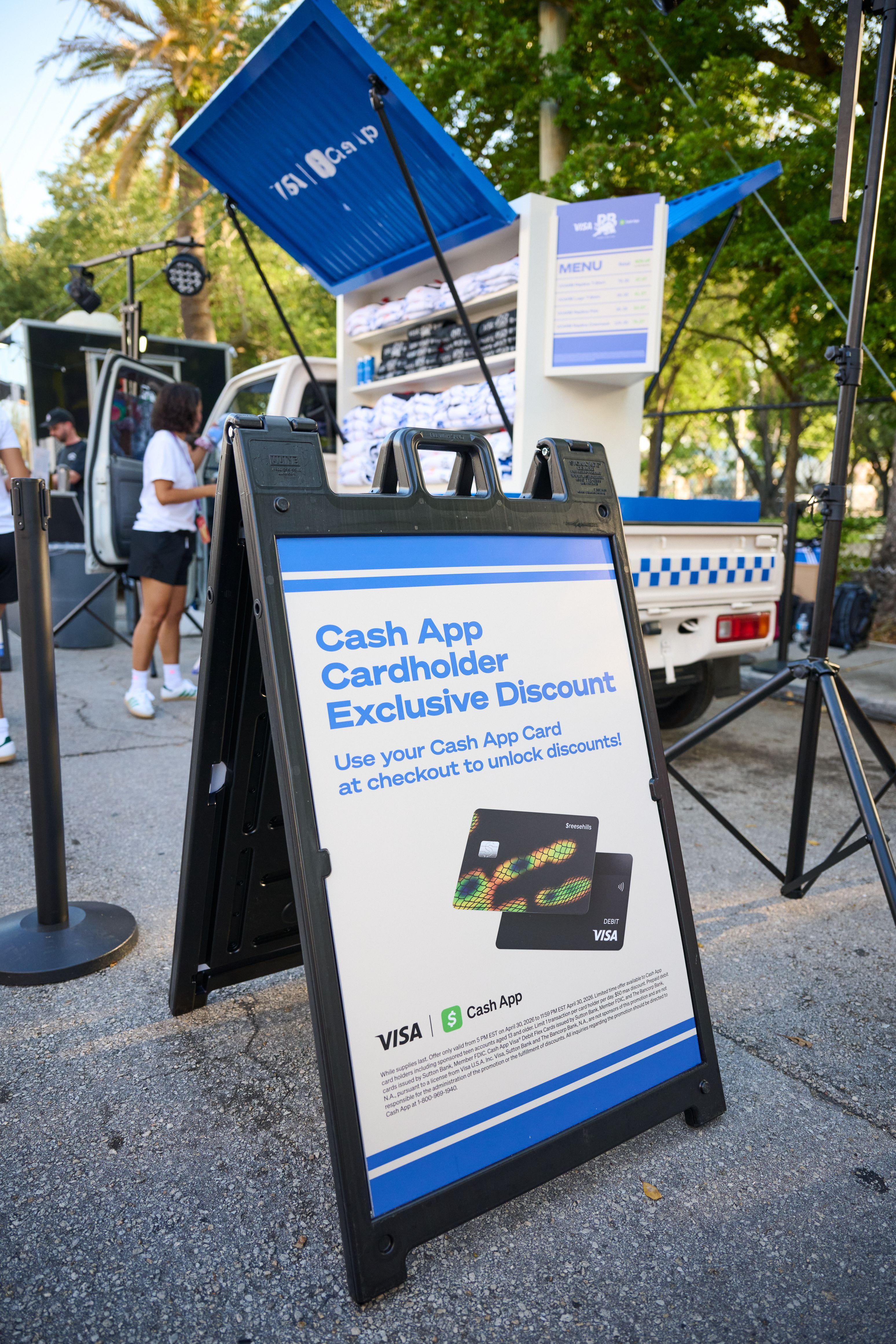 Cash App cardholder discount A-frame sign standing on a sidewalk at an outdoor activation — Brand Collaborations photography, Austin A Cash App cardholder discount A-frame sign standing on a sidewalk at an outdoor activation.