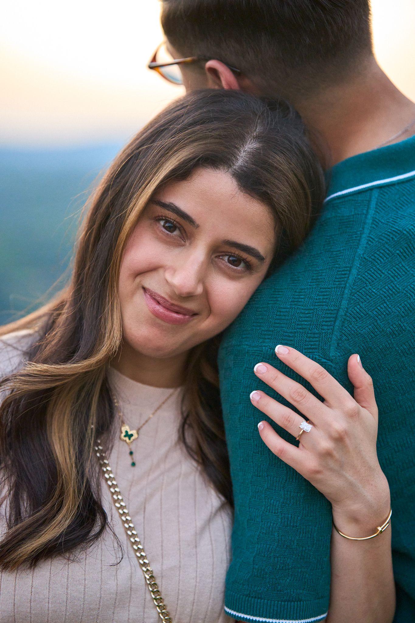 Close view of an engagement ring on a hand resting on a shoulder — Mount Bonnell portraits, Austin Close view of an engagement ring on a hand resting on a shoulder
