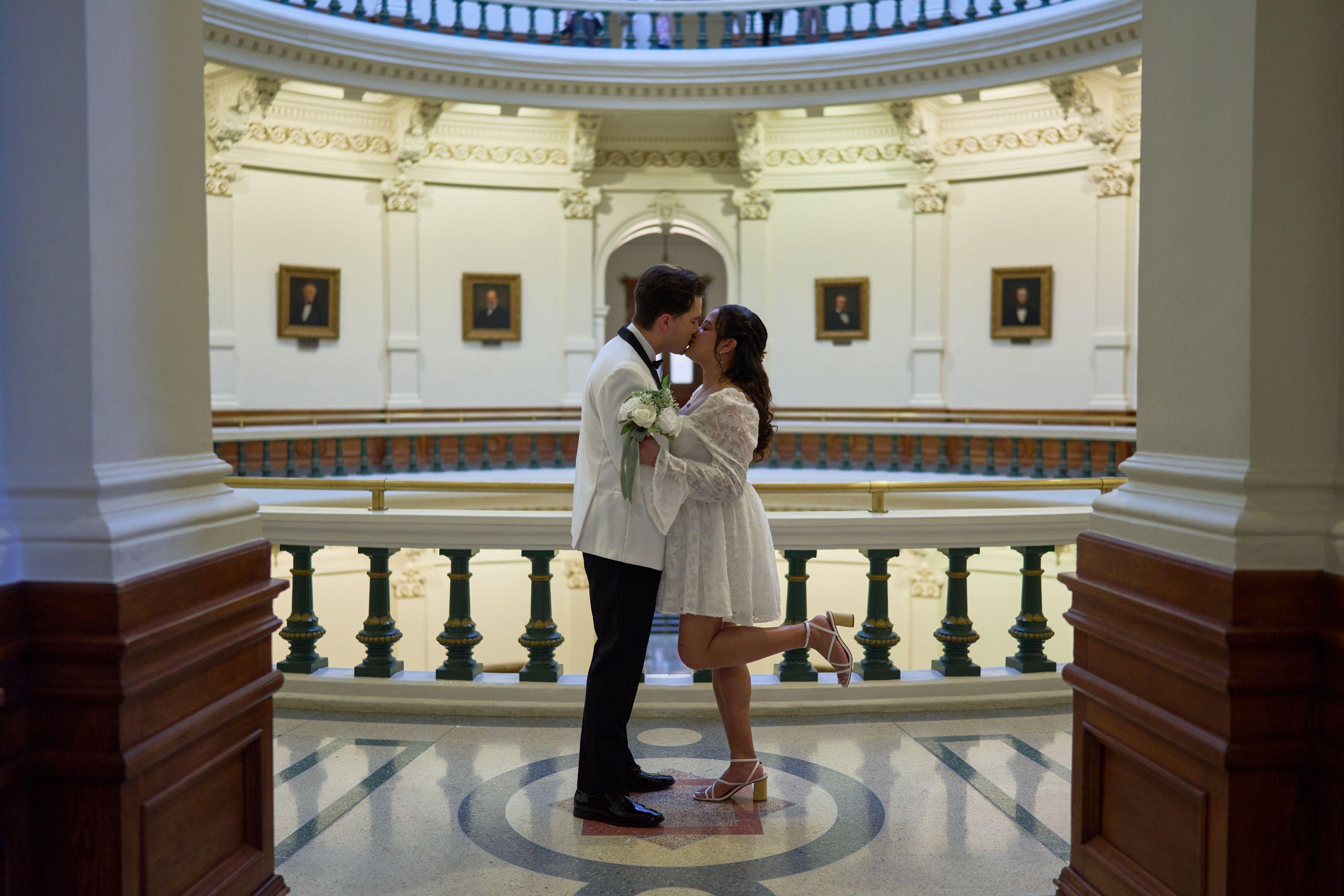 Couple dancing together on the rotunda floor beneath the Capitol dome — Texas State Capitol photography, Austin A couple dancing together on the rotunda floor beneath the Capitol dome.