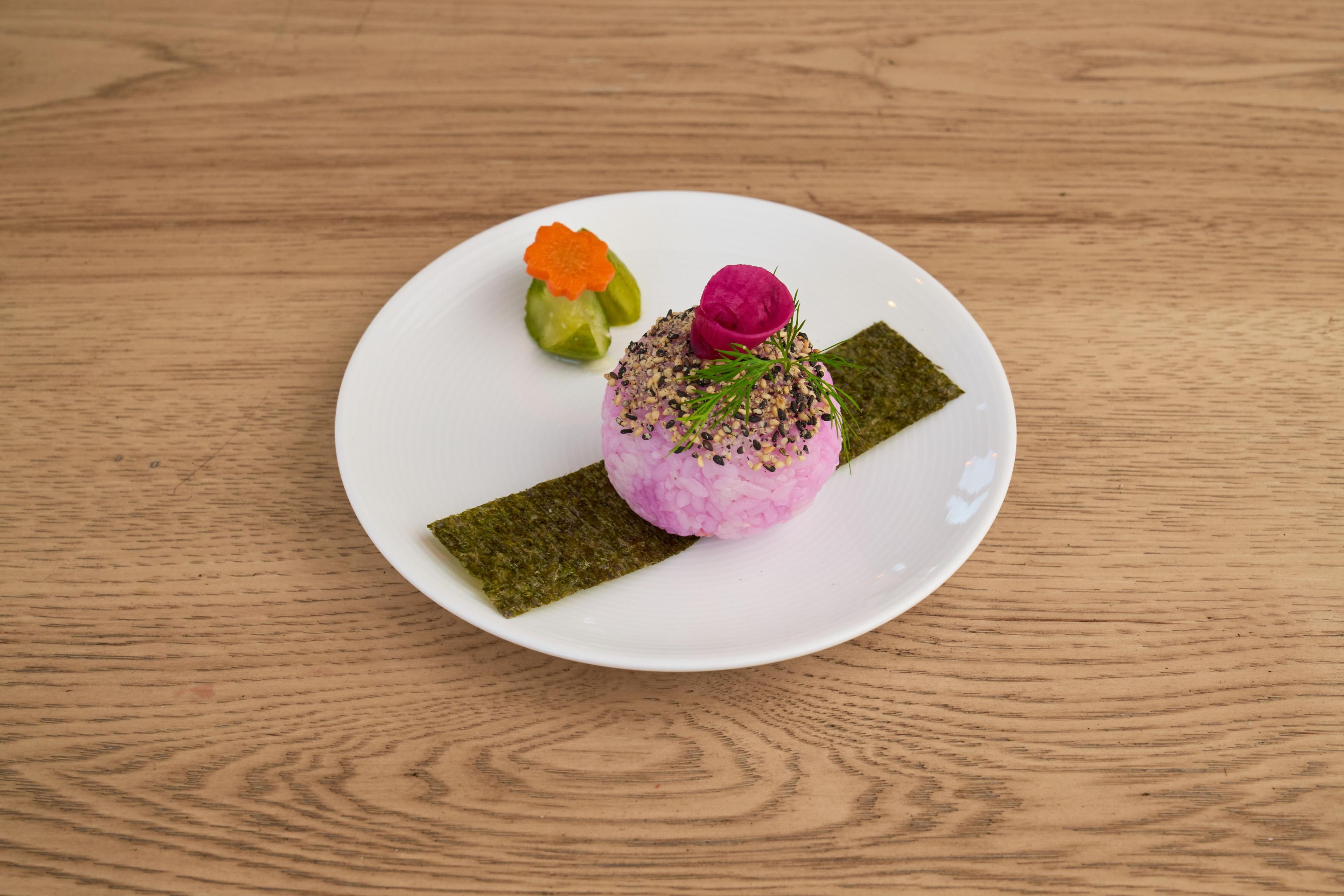 Minimal plated sushi course with nori, pickled radish and rice on a white plate — Food & restaurant photography, Austin A minimal plated sushi course with nori, pickled radish and rice on a white plate.