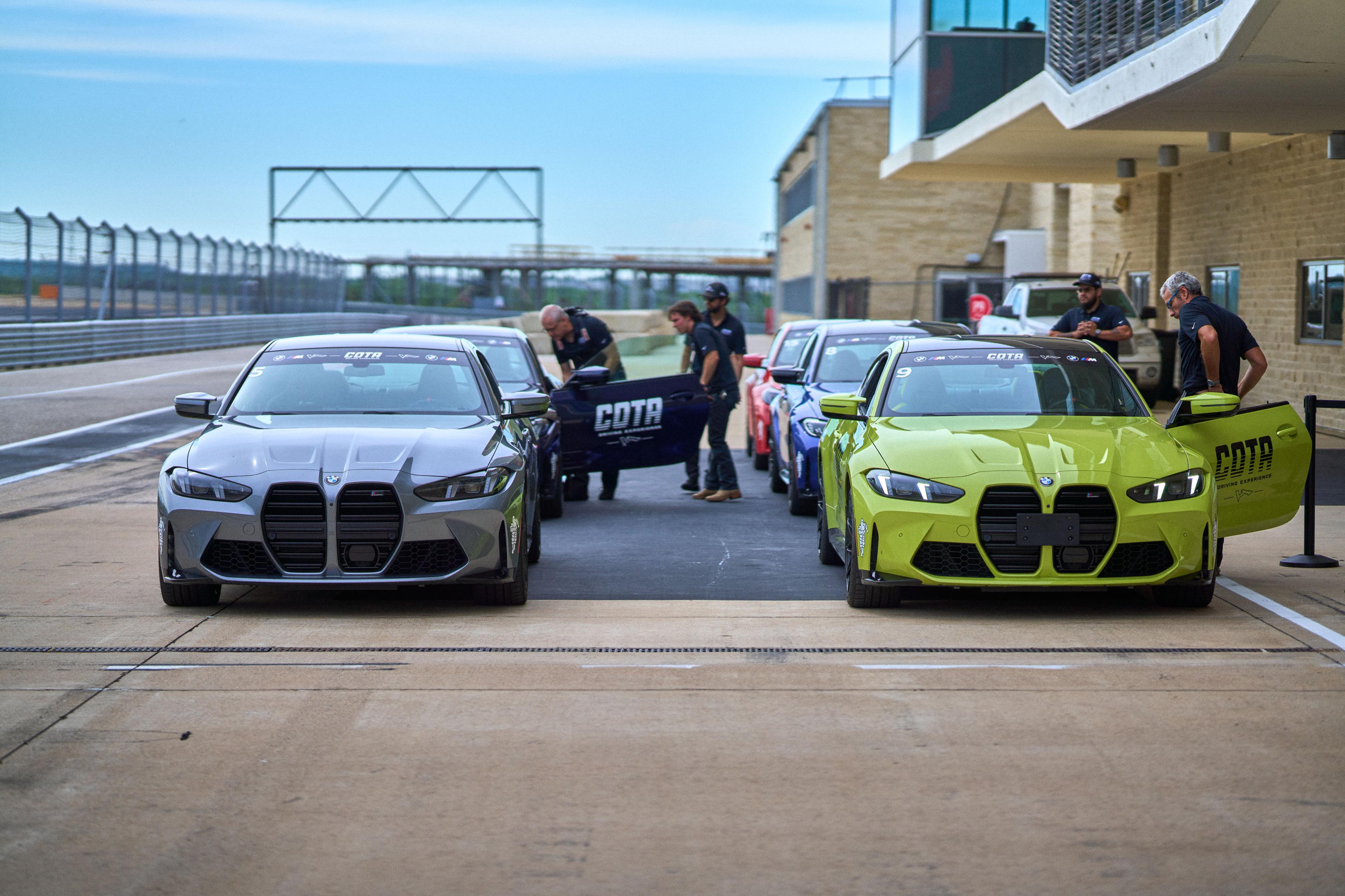 Performance cars lined up in the paddock at a COTA driving experience — Adventure & outdoor photography, Austin Performance cars lined up in the paddock at a COTA driving experience.