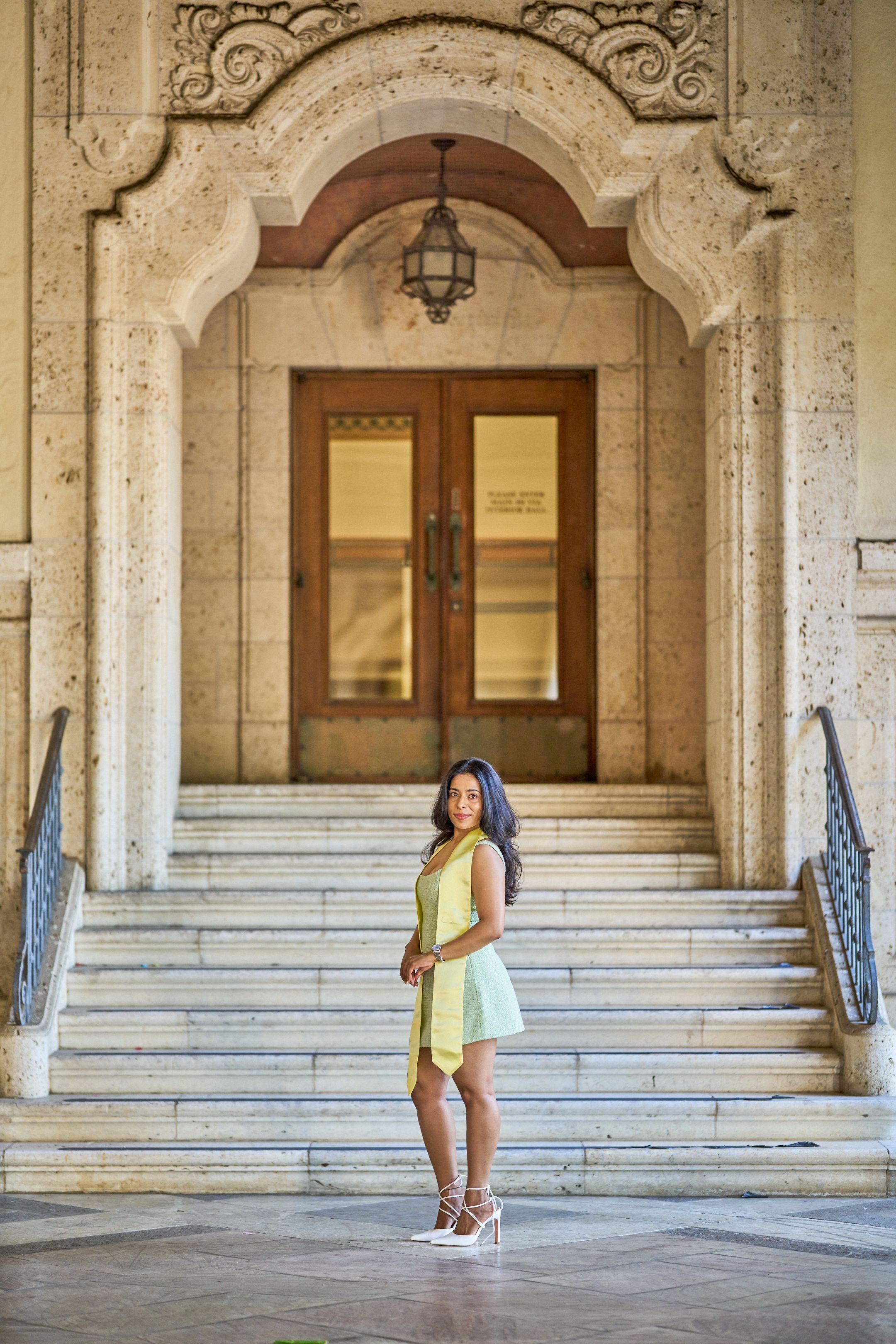 Graduate in a yellow dress and stole on the marble steps of a university entrance — Graduation & Prom photography, Austin A graduate in a yellow dress and stole on the marble steps of a university entrance.