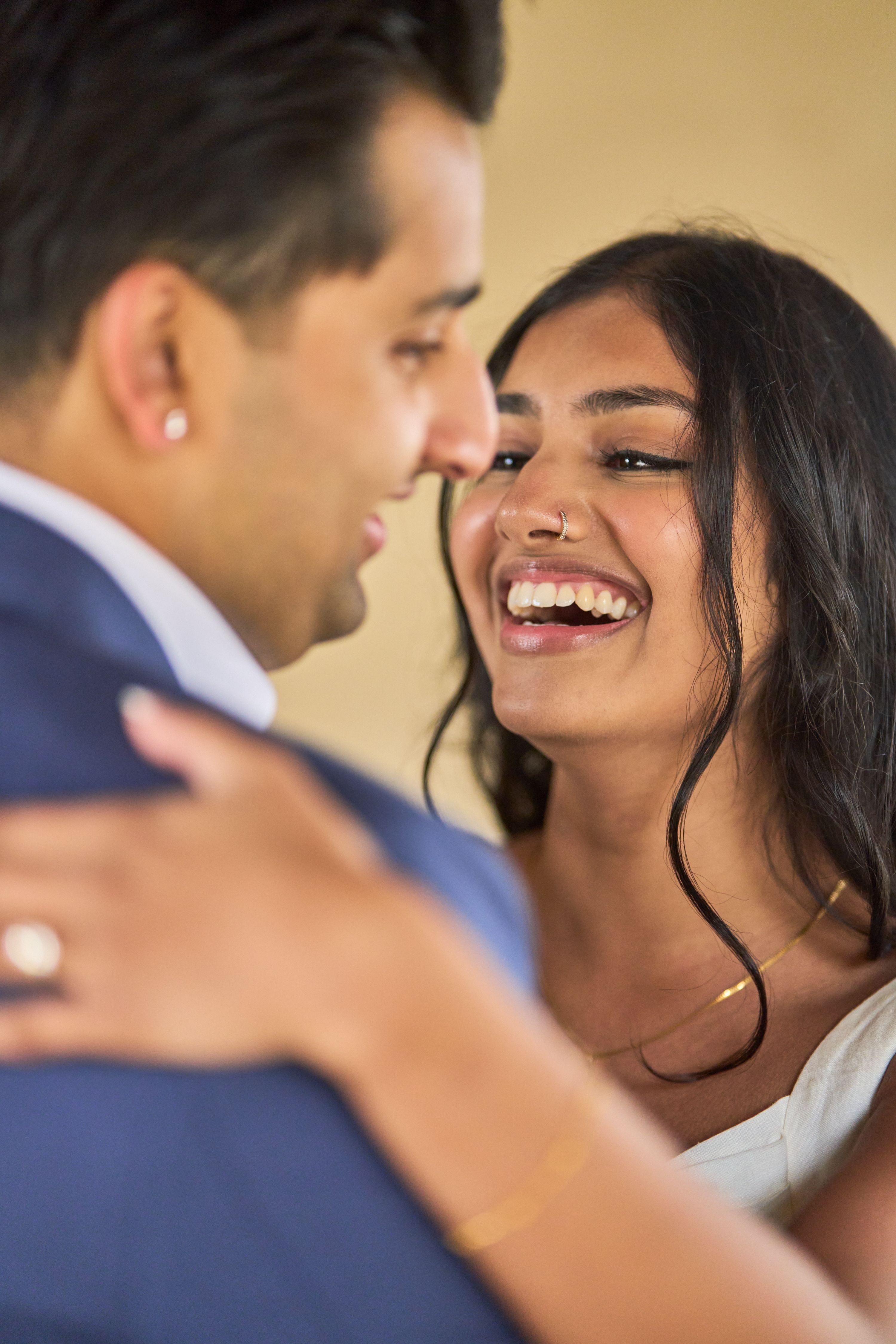 Couple laughing forehead to forehead in the shade of the Chapel Dulcinea arcade — Chapel Dulcinea photography, Austin A couple laughing forehead to forehead in the shade of the Chapel Dulcinea arcade