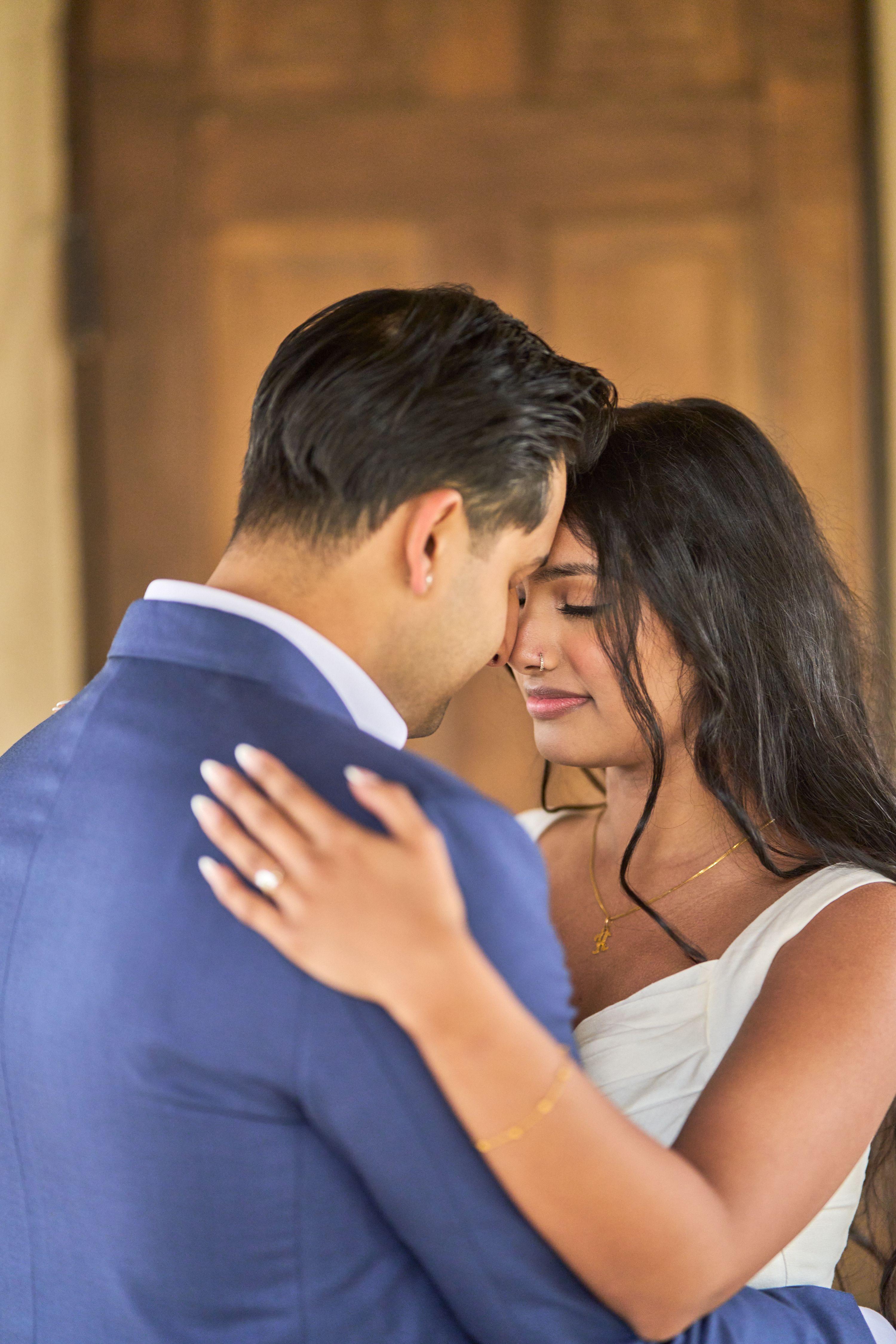 Couple standing close in the doorway of Chapel Dulcinea, her arms around his neck — Chapel Dulcinea photography, Austin A couple standing close in the doorway of Chapel Dulcinea, her arms around his neck