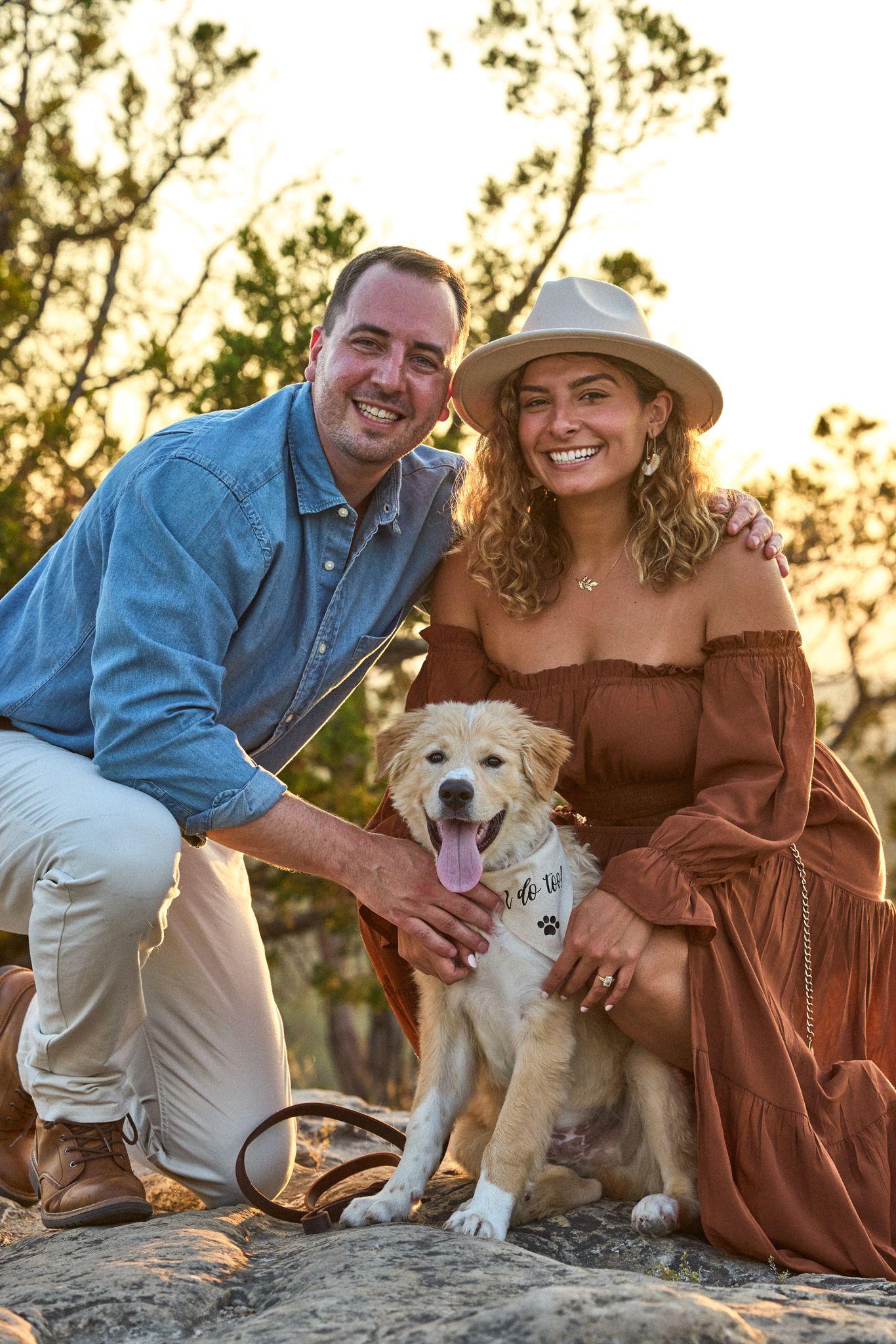 Couple kneeling with their golden retriever in the Wimberley grass at golden hour — Wimberley TX photography, Austin A couple kneeling with their golden retriever in the Wimberley grass at golden hour