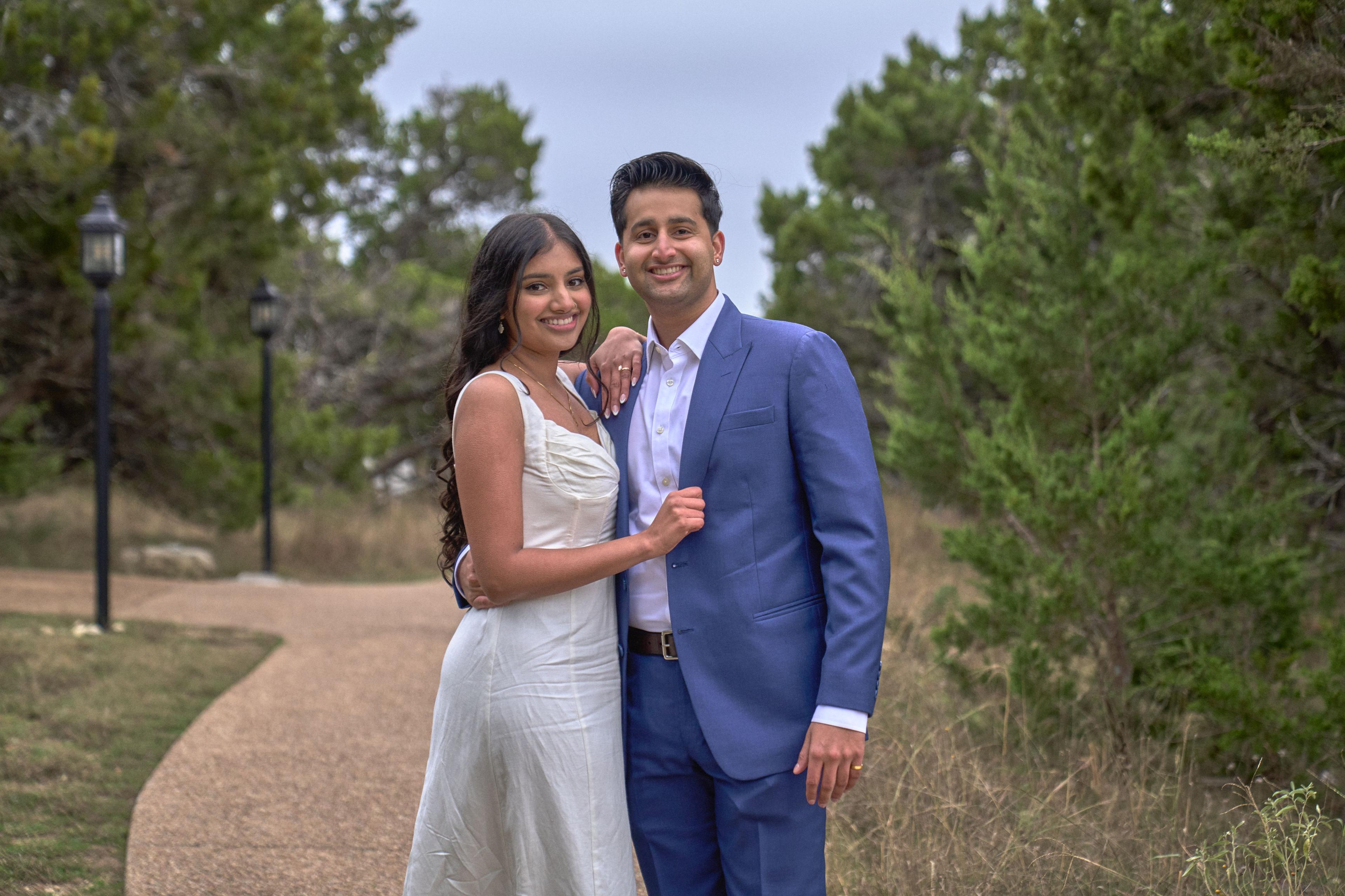 Couple standing together in the pines on the bluff below Chapel Dulcinea — Chapel Dulcinea photography, Austin A couple standing together in the pines on the bluff below Chapel Dulcinea