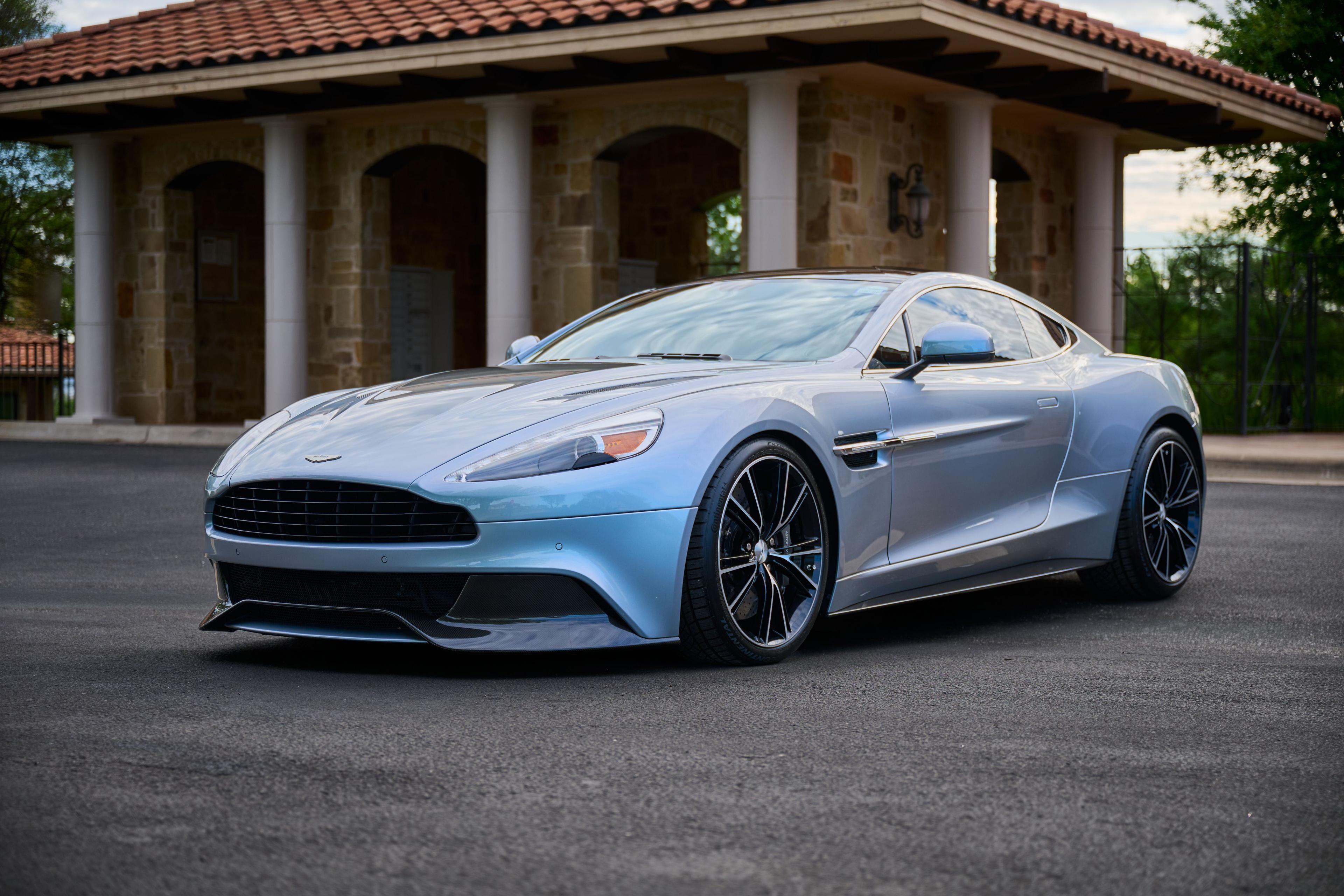 Silver Aston Martin Vanquish parked in front of a Spanish-tile villa — Automotive photography, Austin A silver Aston Martin Vanquish parked in front of a Spanish-tile villa.