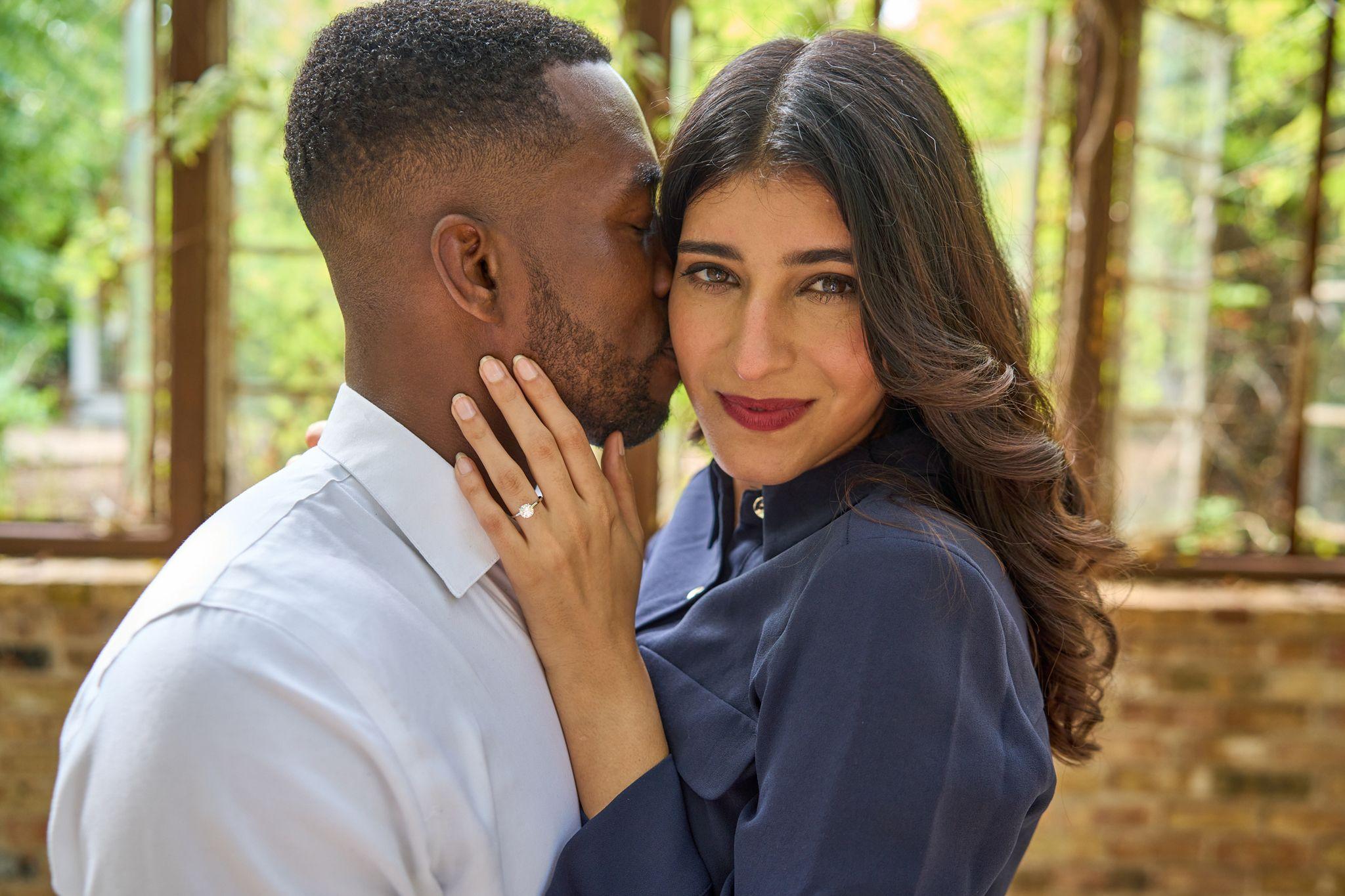 Couple close together after a proposal, her engagement ring on his cheek — Sekrit Theater photography, Austin A couple close together after a proposal, her engagement ring on his cheek