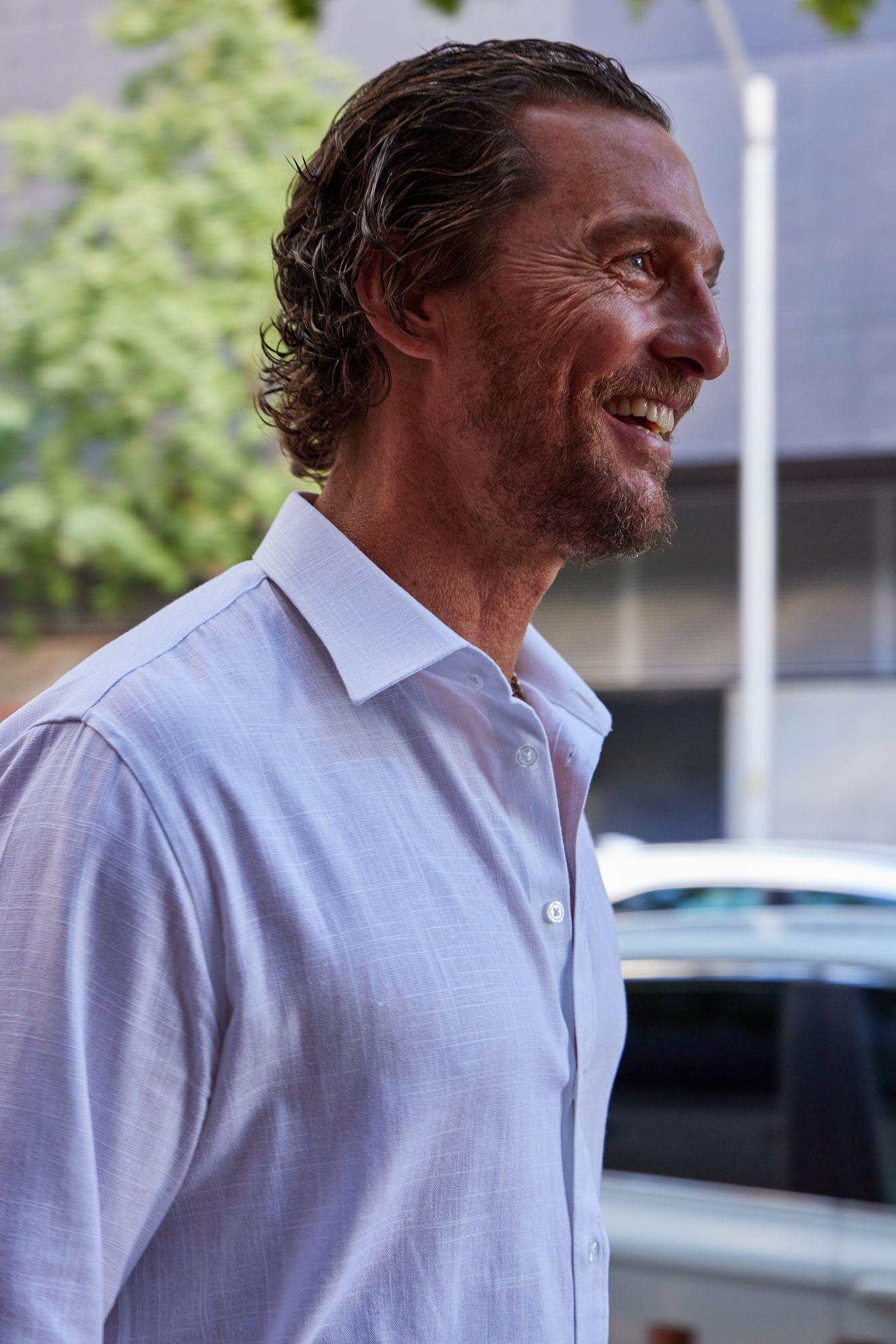 Matthew McConaughey in a white shirt outdoors, looking off camera — Brand Collaborations photography, Austin Matthew McConaughey in a white shirt outdoors, looking off camera at a Pantalones Tequila brand event.