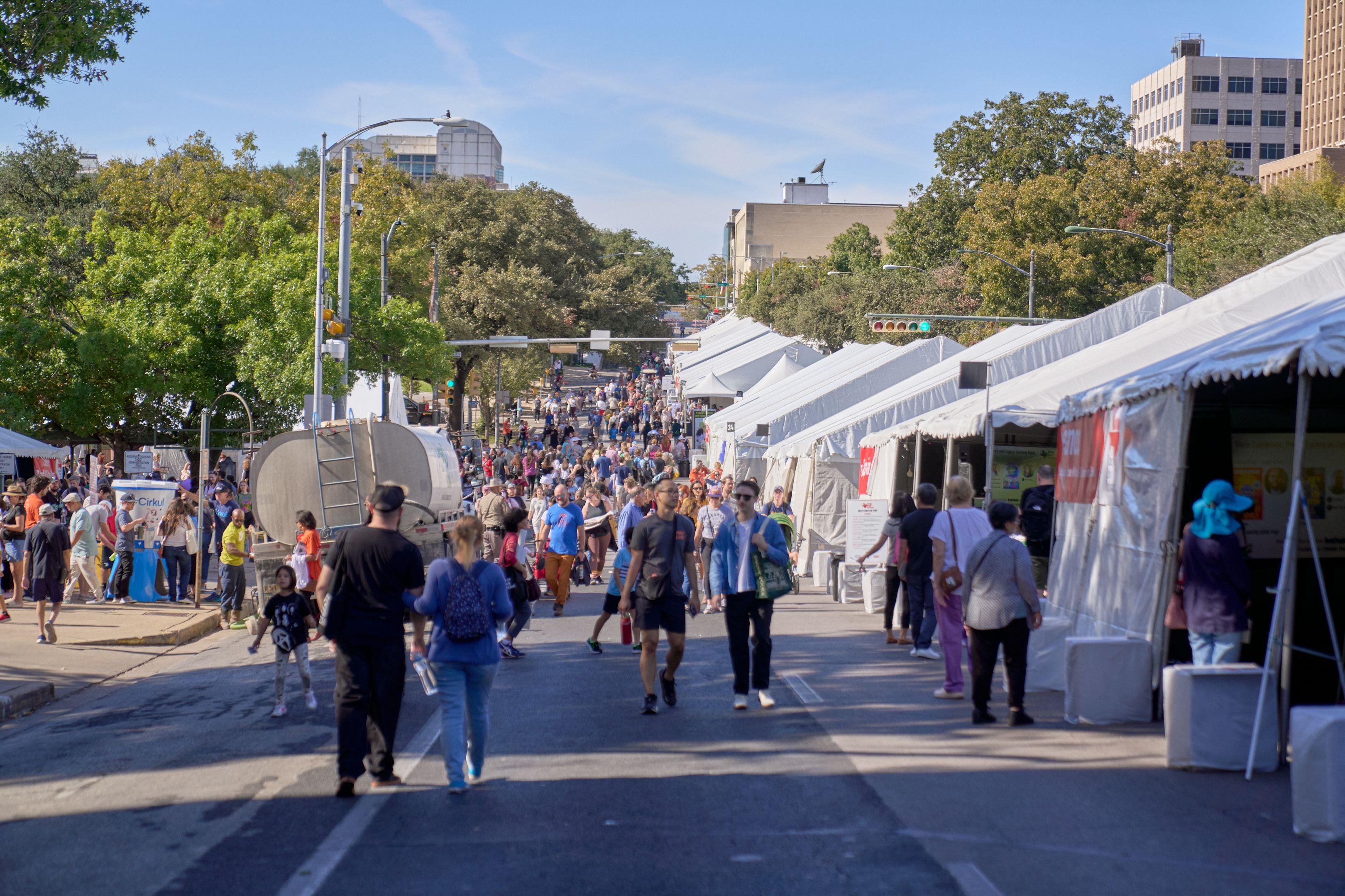 Crowds walking between white festival tents along Congress Avenue — Congress Avenue photography, Austin Crowds walking between white festival tents along Congress Avenue.