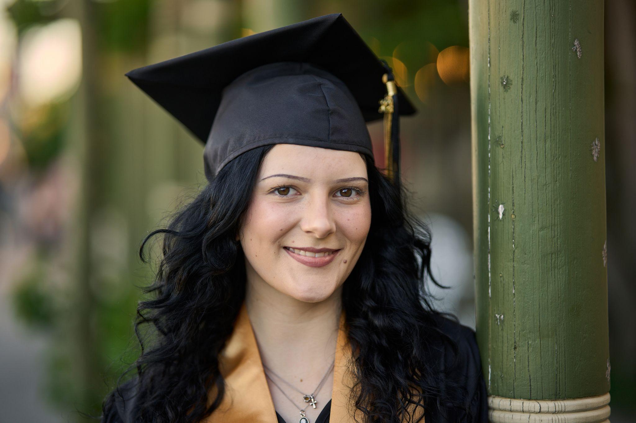 Close portrait of a graduate in a black cap and gold stole — Graduation & Prom photography, Austin A close portrait of a graduate in a black cap and gold stole.