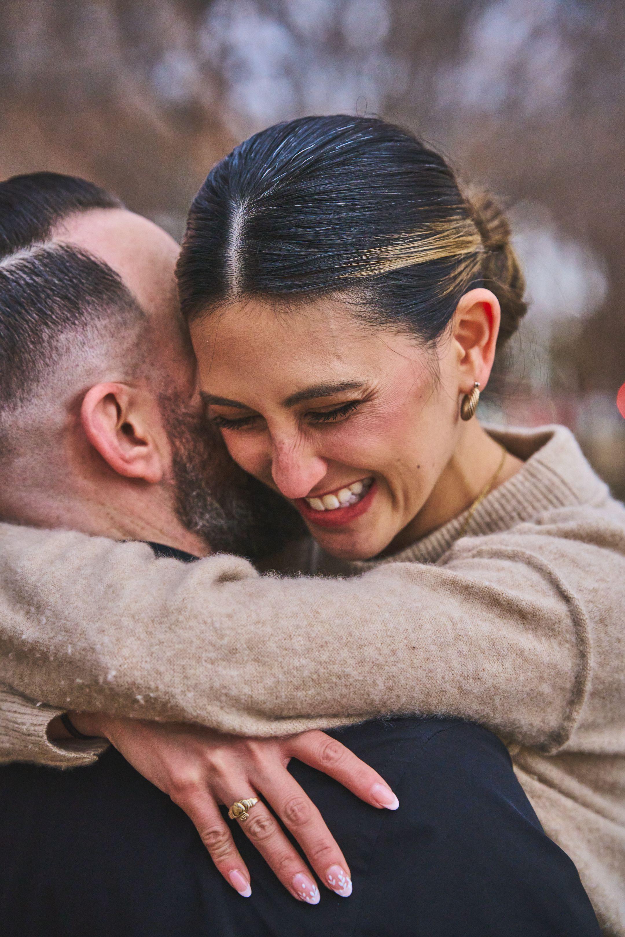 Couple holding each other tightly, both laughing, just after saying yes — Engagement & Proposals photography, Austin A couple holding each other tightly, both laughing, just after saying yes.