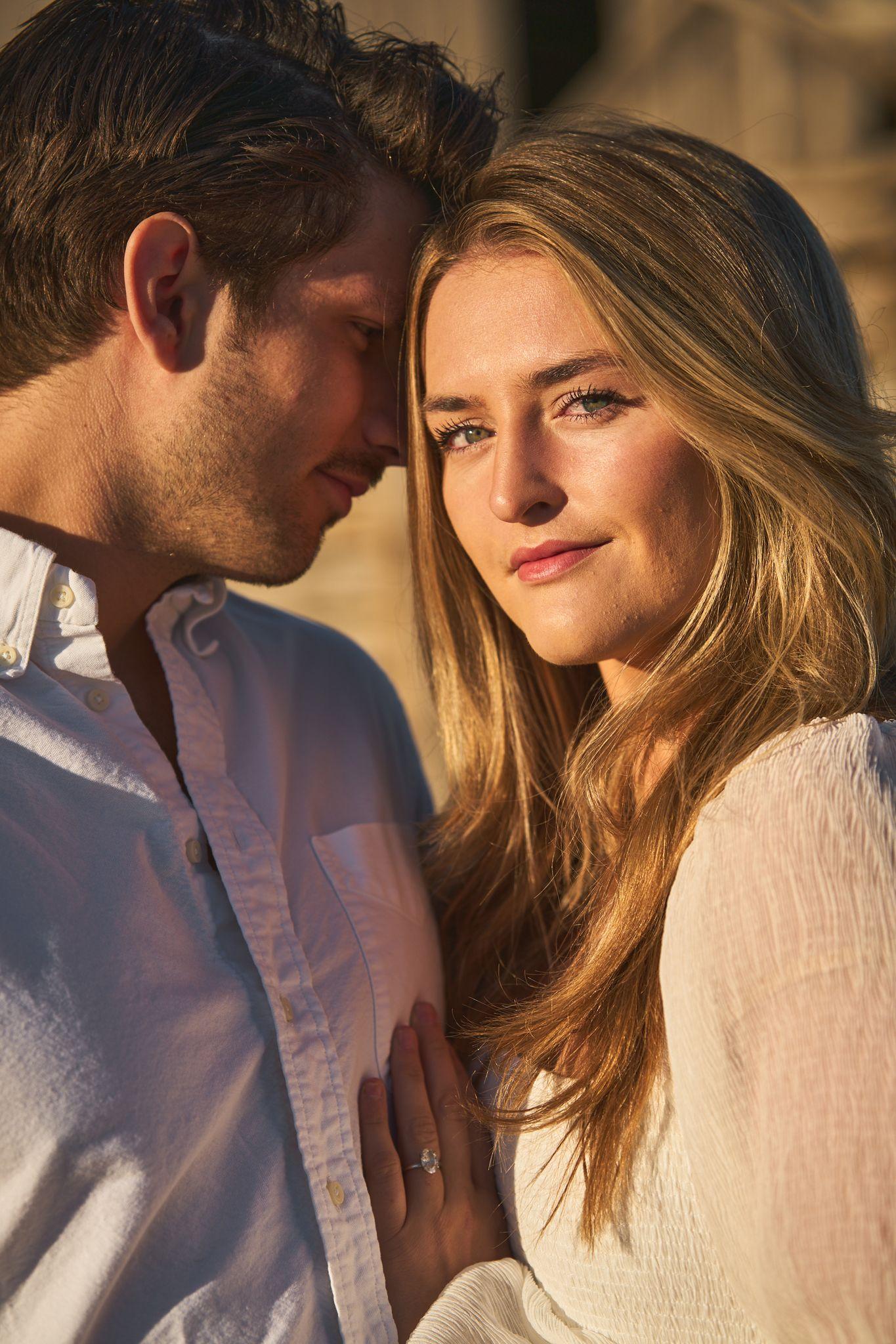 Couple leaning into each other in low golden light, she looking to camera — Commons Ford Ranch photography, Austin A couple leaning into each other in low golden light, she looking to camera.