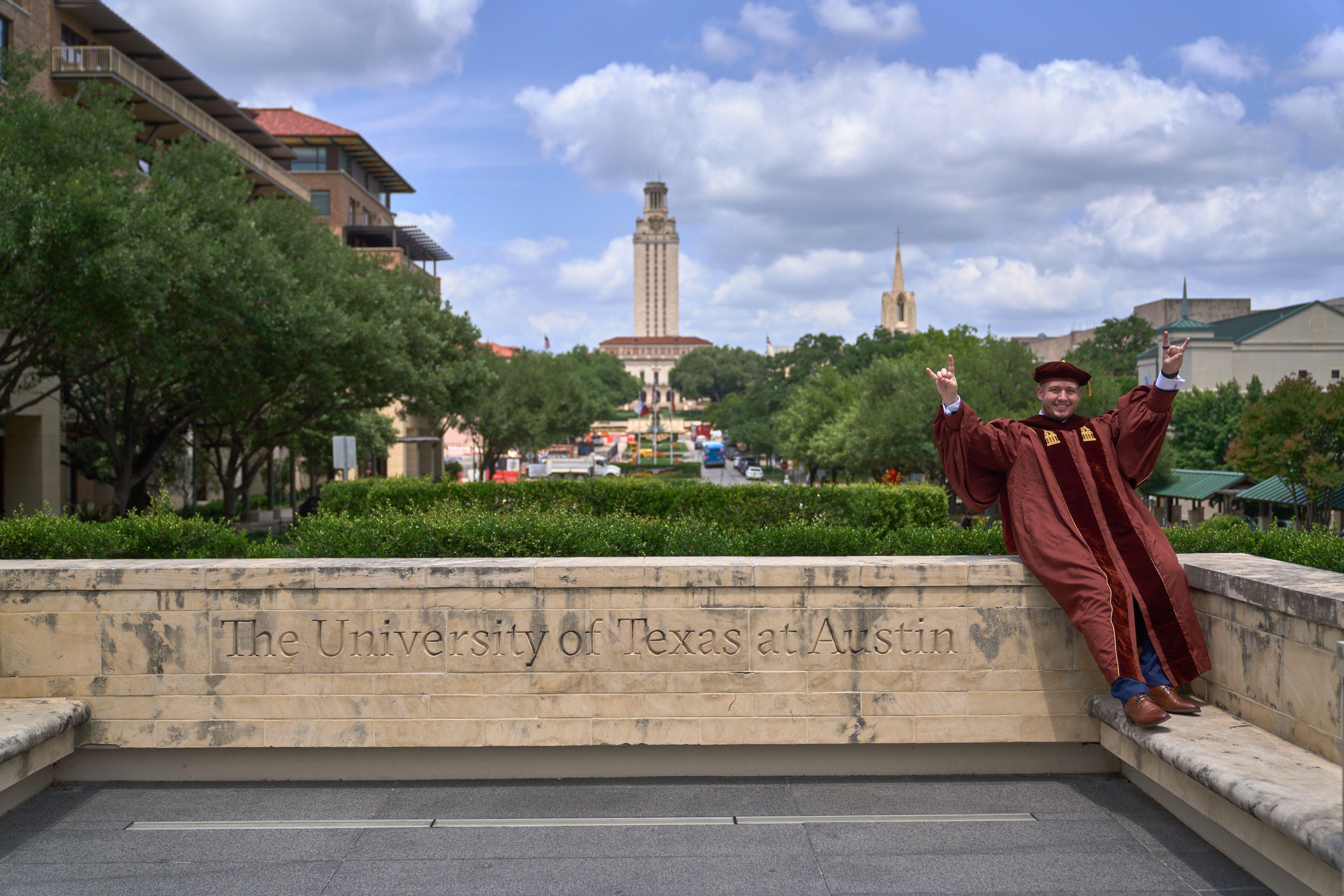 UT Tower seen down the mall above stone lettering reading University of Texas at Austin — UT Austin photography, Austin The UT Tower seen down the mall above stone lettering reading University of Texas at Austin.