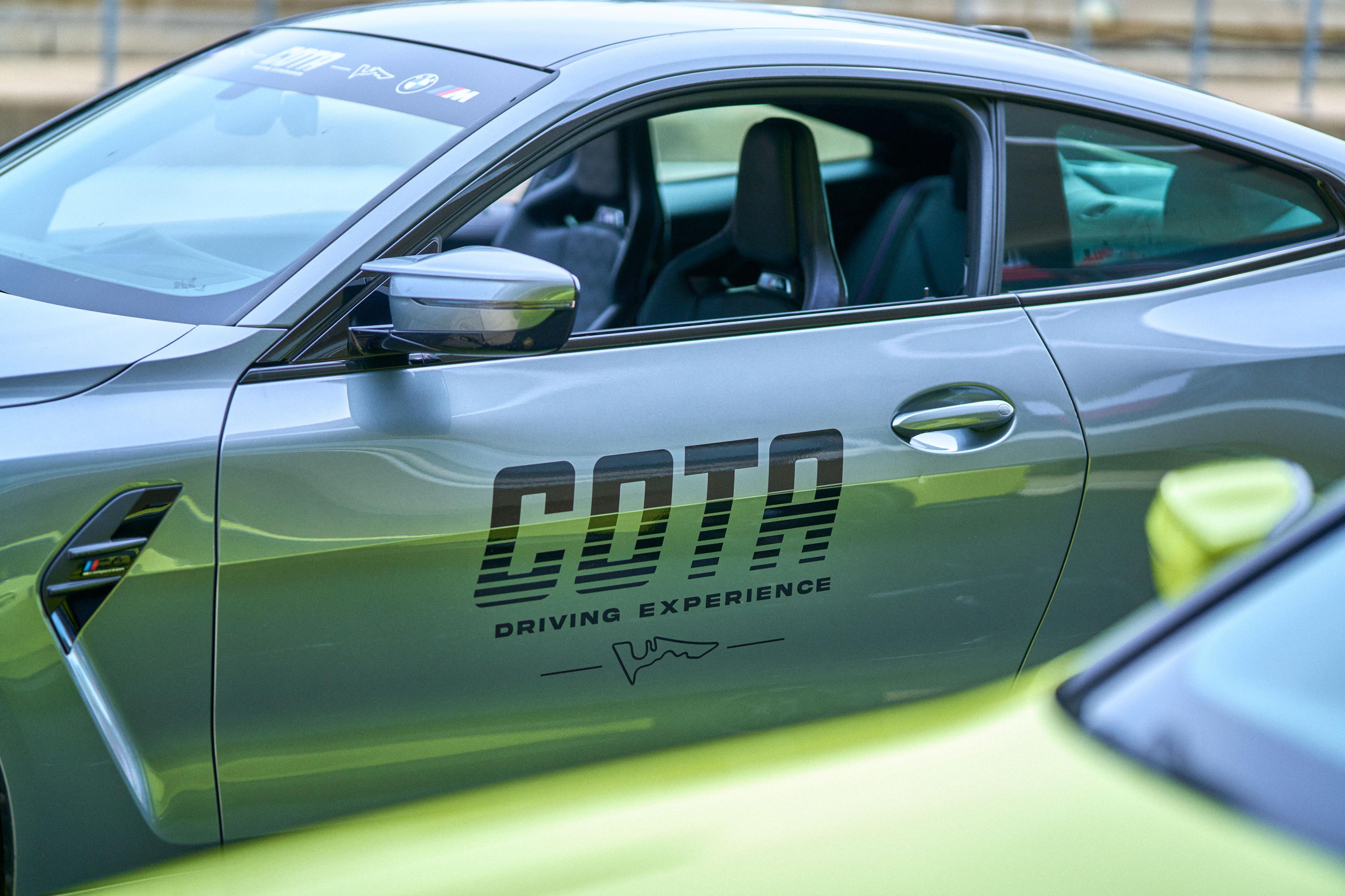 Lime green BMW carrying COTA Driving Experience livery along its flank, shot close on the door — Brand Collaborations photography, Austin A lime green BMW carrying COTA Driving Experience livery along its flank, shot close on the door and mirror.