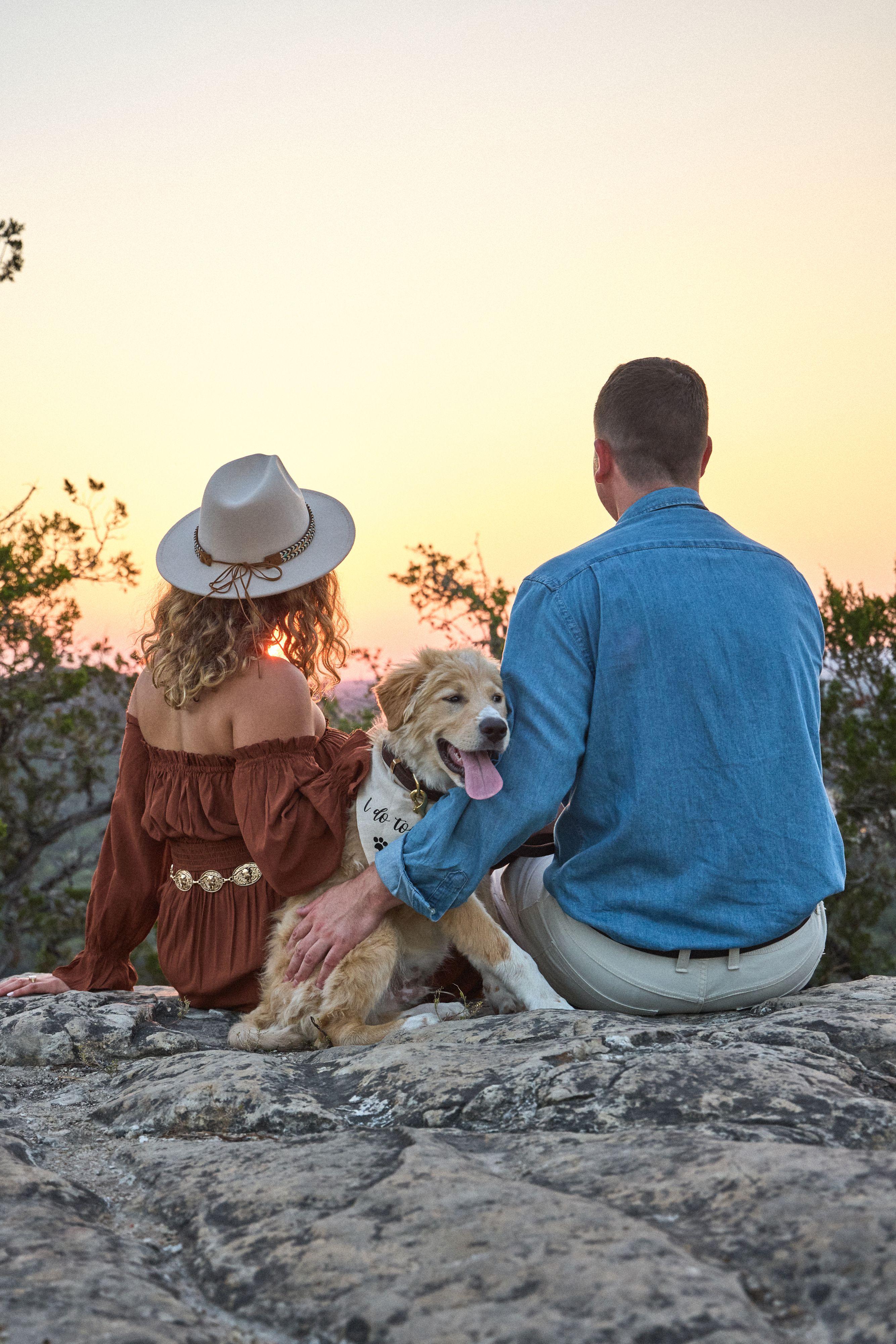Couple and their golden retriever sitting on the limestone at sunset — Wimberley TX photography, Austin Wimberley TX