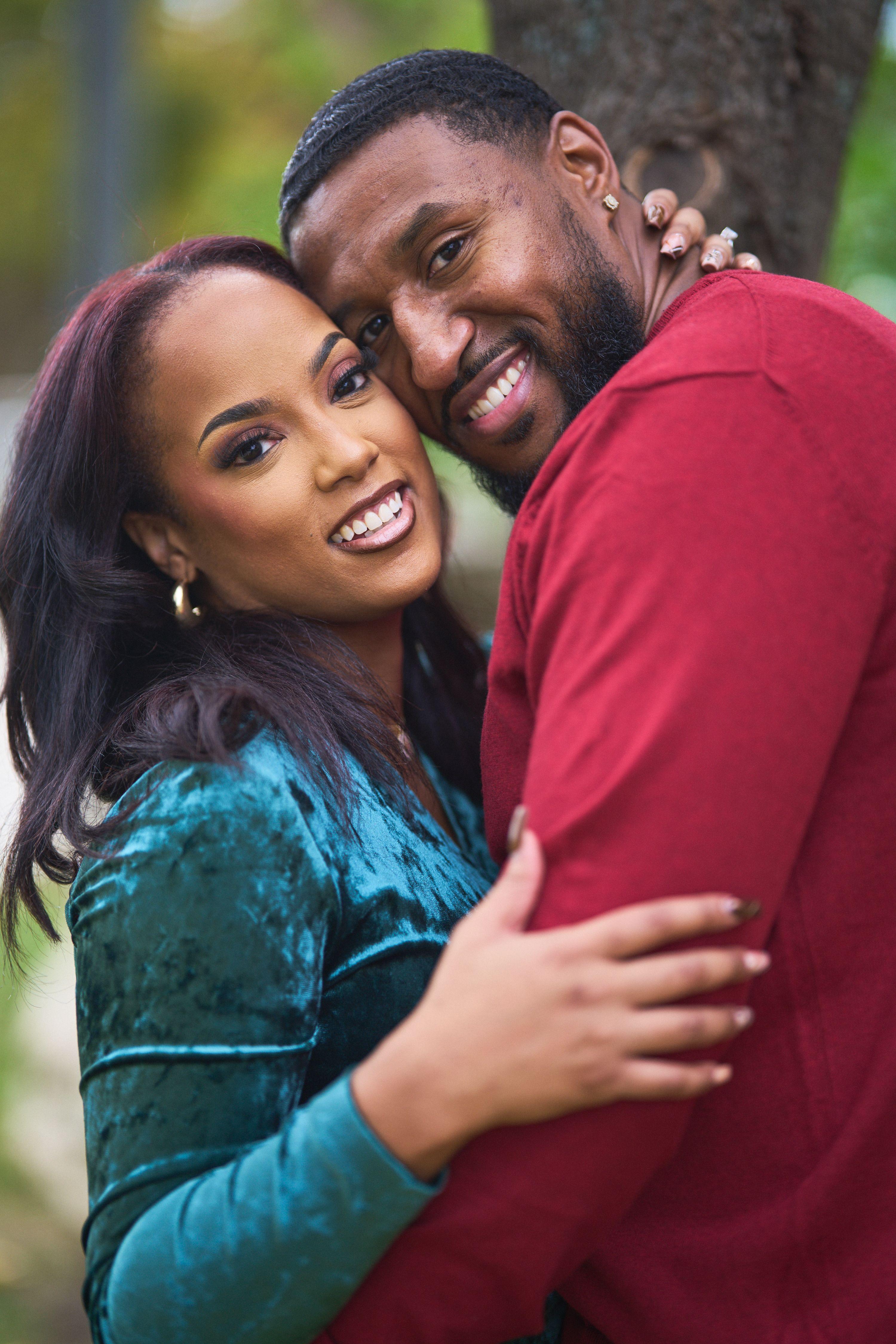 Couple in green velvet and red cheek to cheek, both smiling — Seasonal Christmas & Fall photography, Austin A couple in green velvet and red cheek to cheek, both smiling.