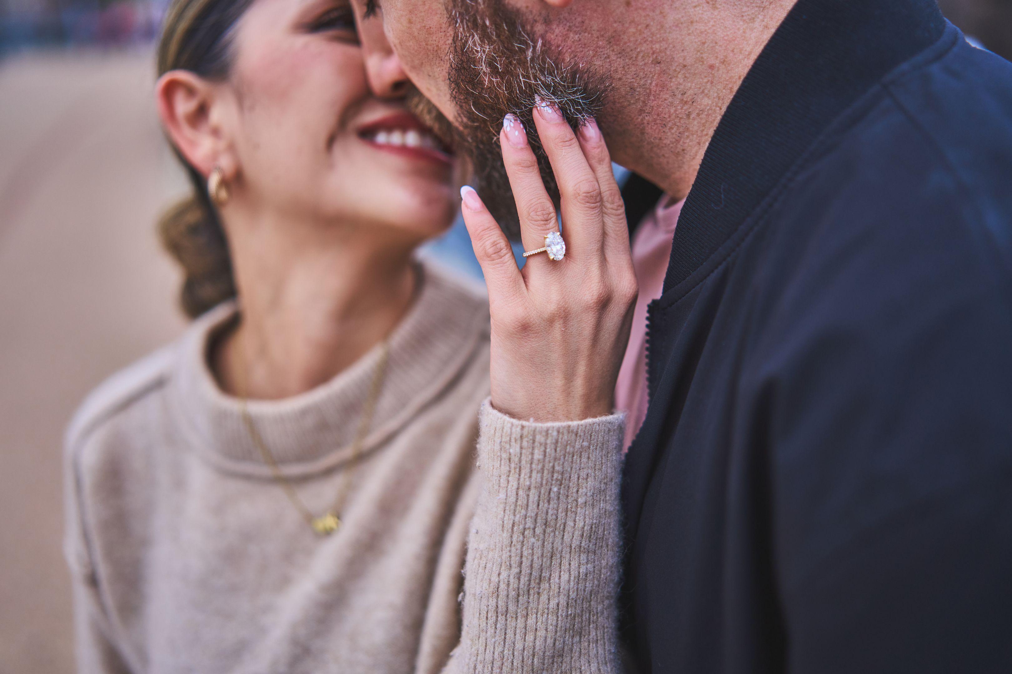 Close view of a newly engaged woman's hand raised to show her diamond ring — Engagement & Proposals photography, Austin A close view of a newly engaged woman's hand raised to show her diamond ring.