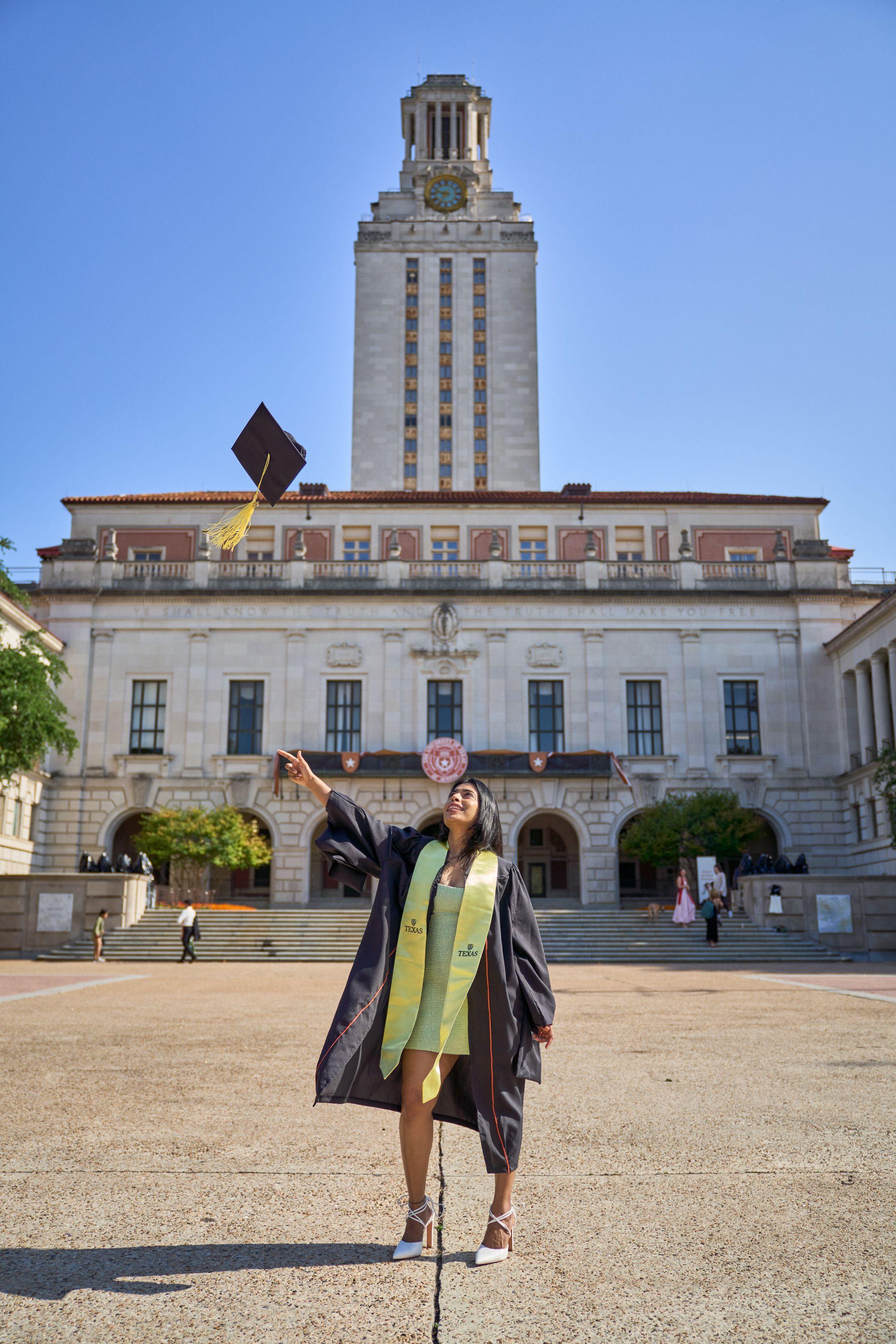 Graduate tossing her cap in the air in the plaza below the UT Tower — Graduation & Prom photography, Austin A graduate tossing her cap in the air in the plaza below the UT Tower.